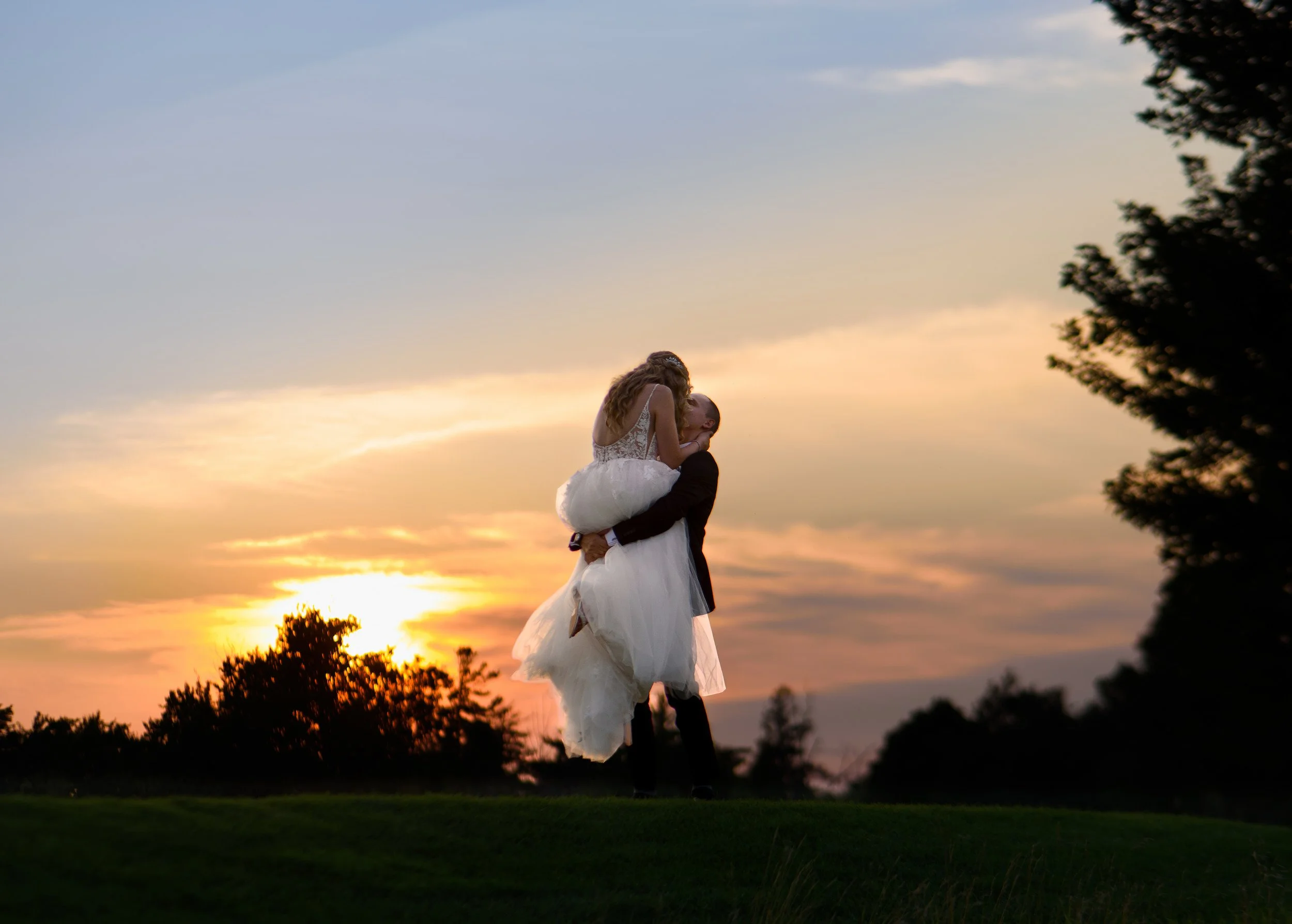 Sunset silhouette lift on the greens at Whistle Bear Golf Club, Cambridge, Ontario