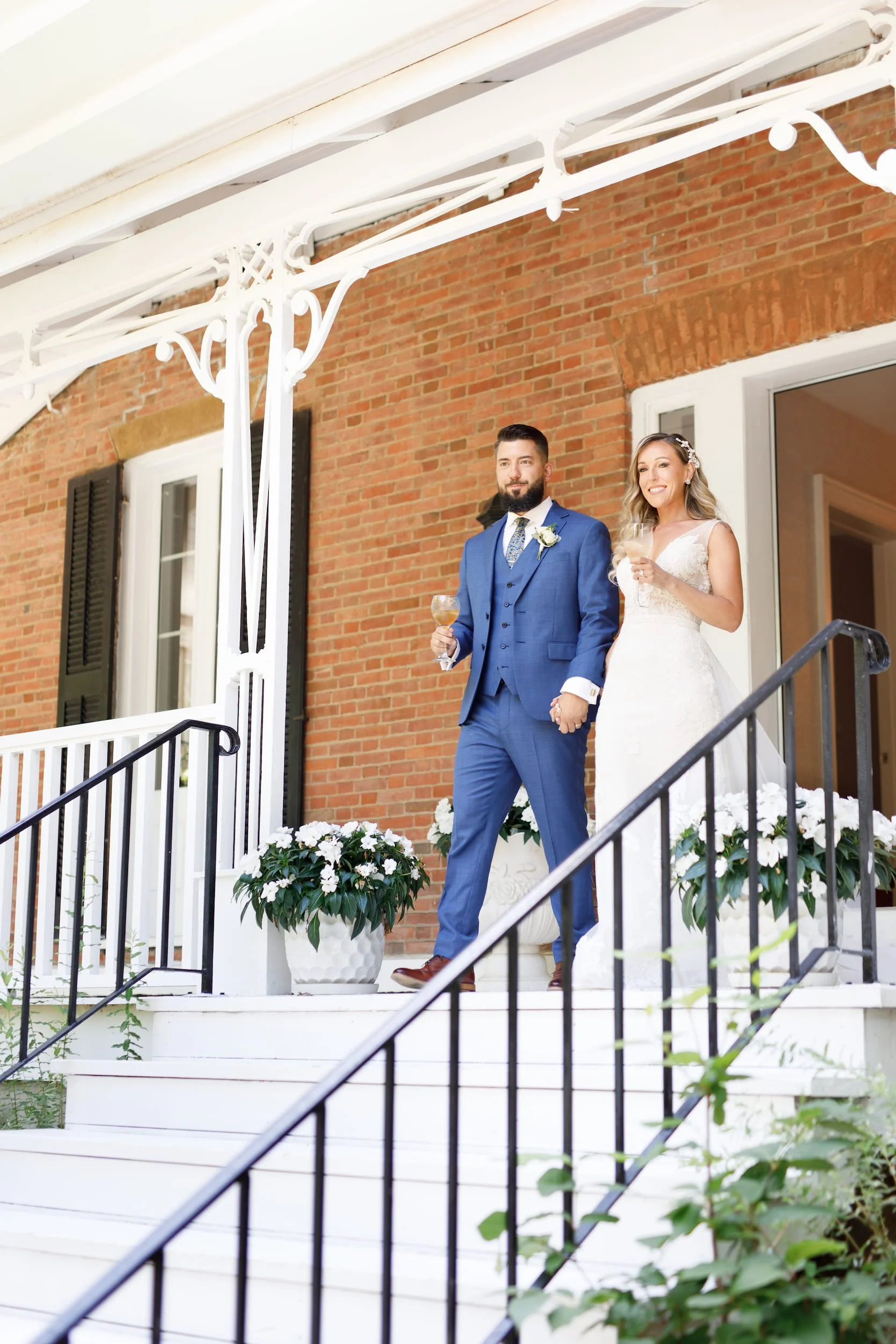 Bride and groom champagne entrance from Gracewood Estate farmhouse