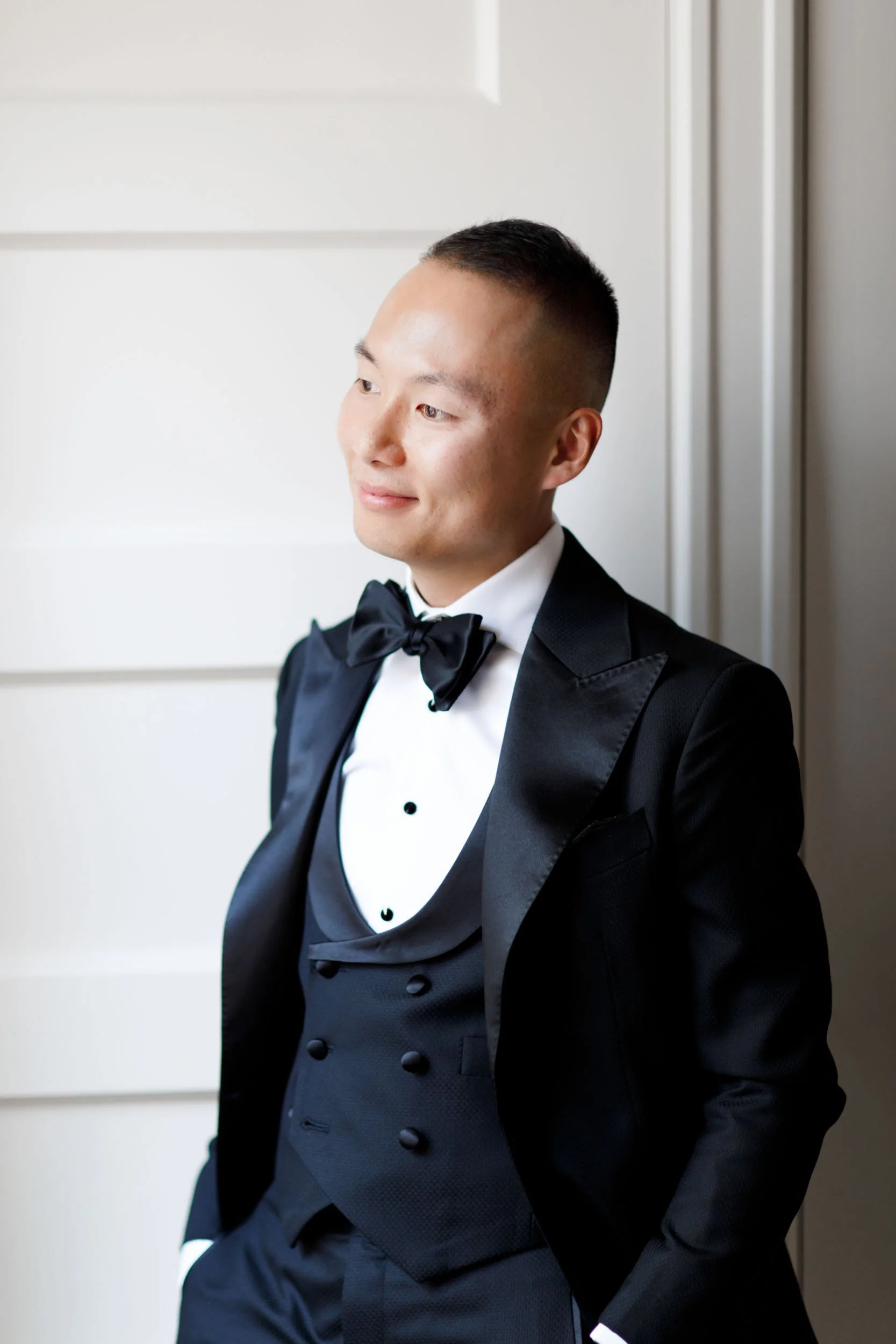 Groom portrait in classic tuxedo at Omni King Edward Hotel in Toronto