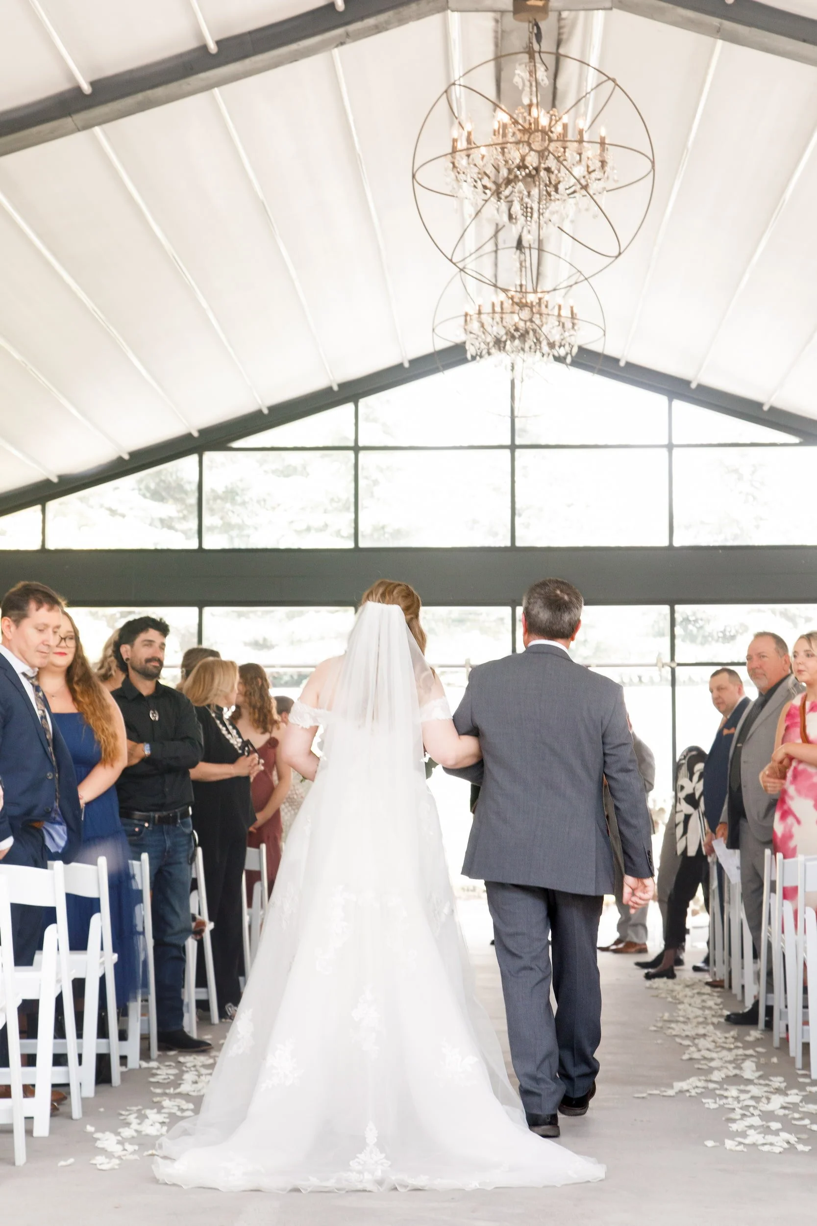 Bride walking down the aisle with her father at Whistle Bear Golf Club wedding in Cambridge, Ontario