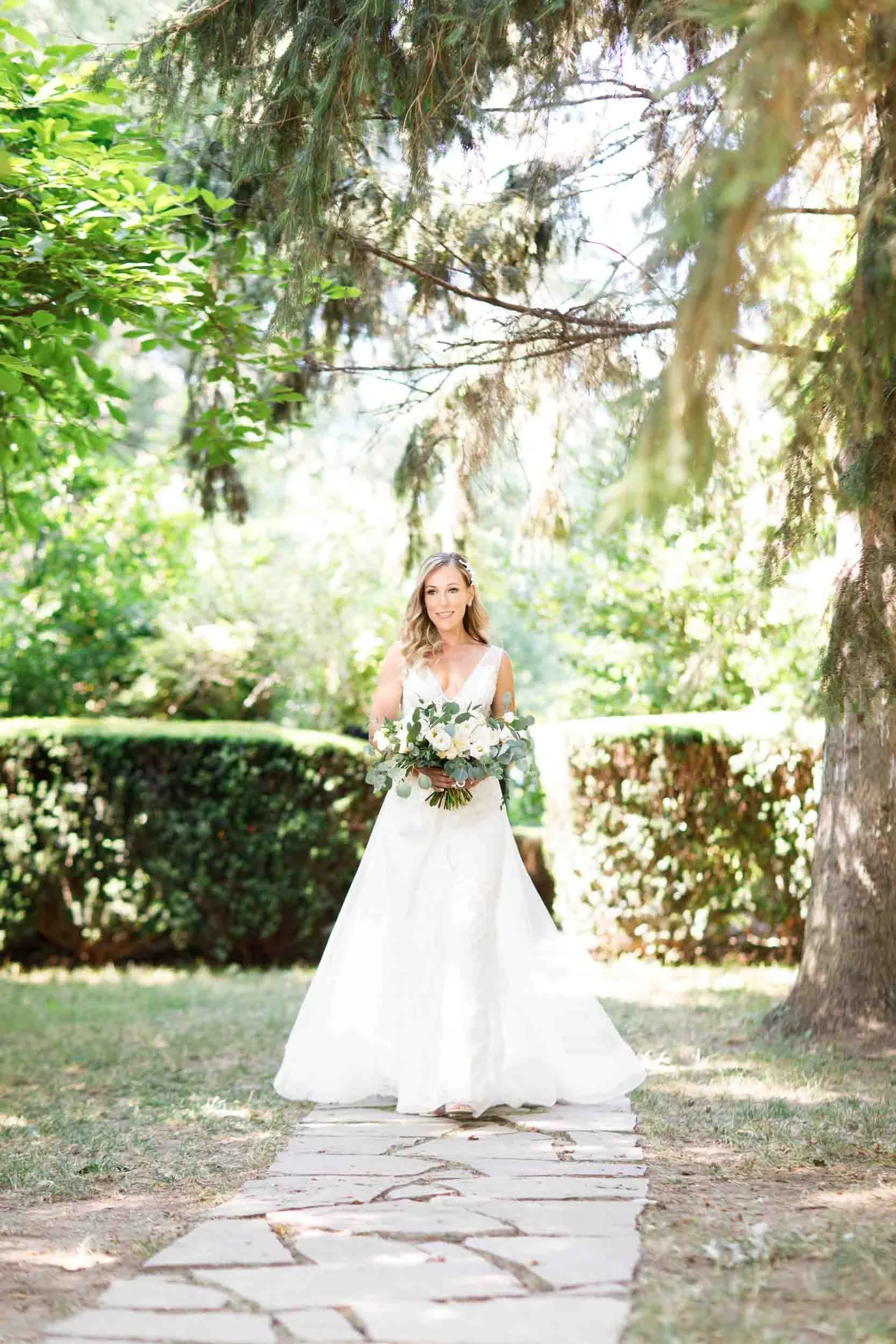 Bridal portrait beneath orchard trees at Kurtz Orchards