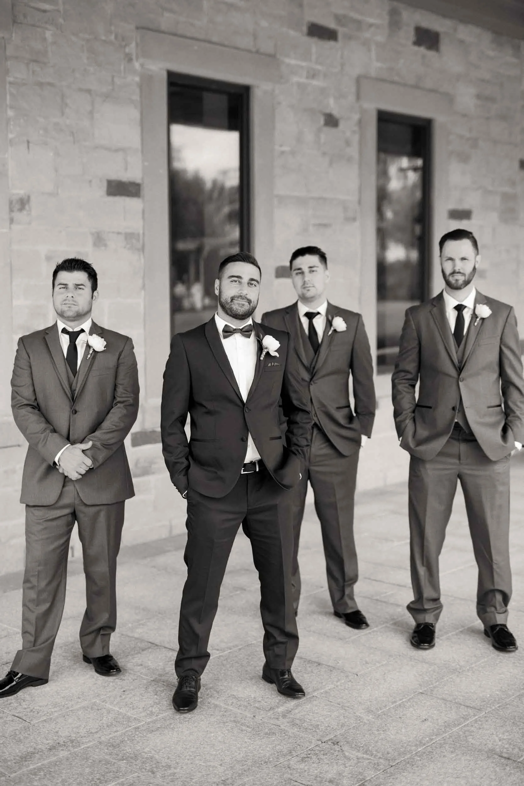 Black and white groomsmen portrait outside the Arlington Estate in Vaughan