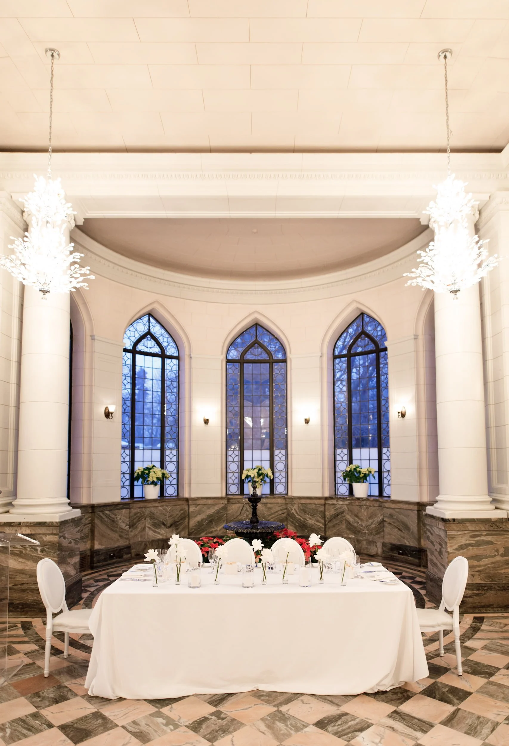 Head table beneath Gothic windows in Casa Loma Conservatory