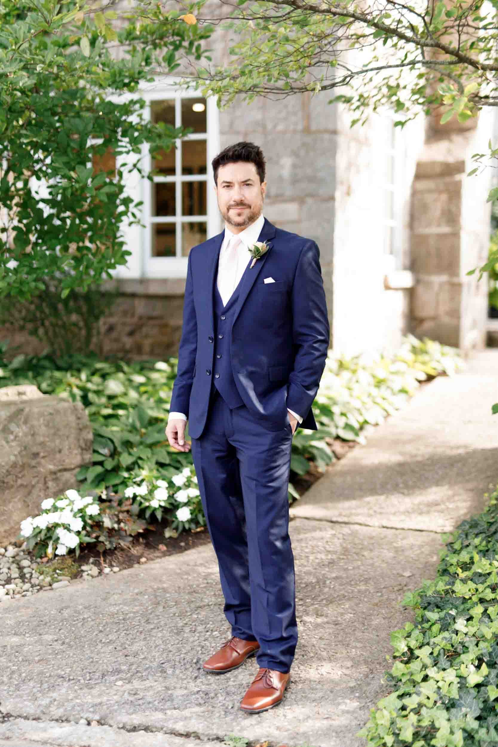 Groom portrait on the grounds of the Ancaster Mill in Ancaster, Ontario
