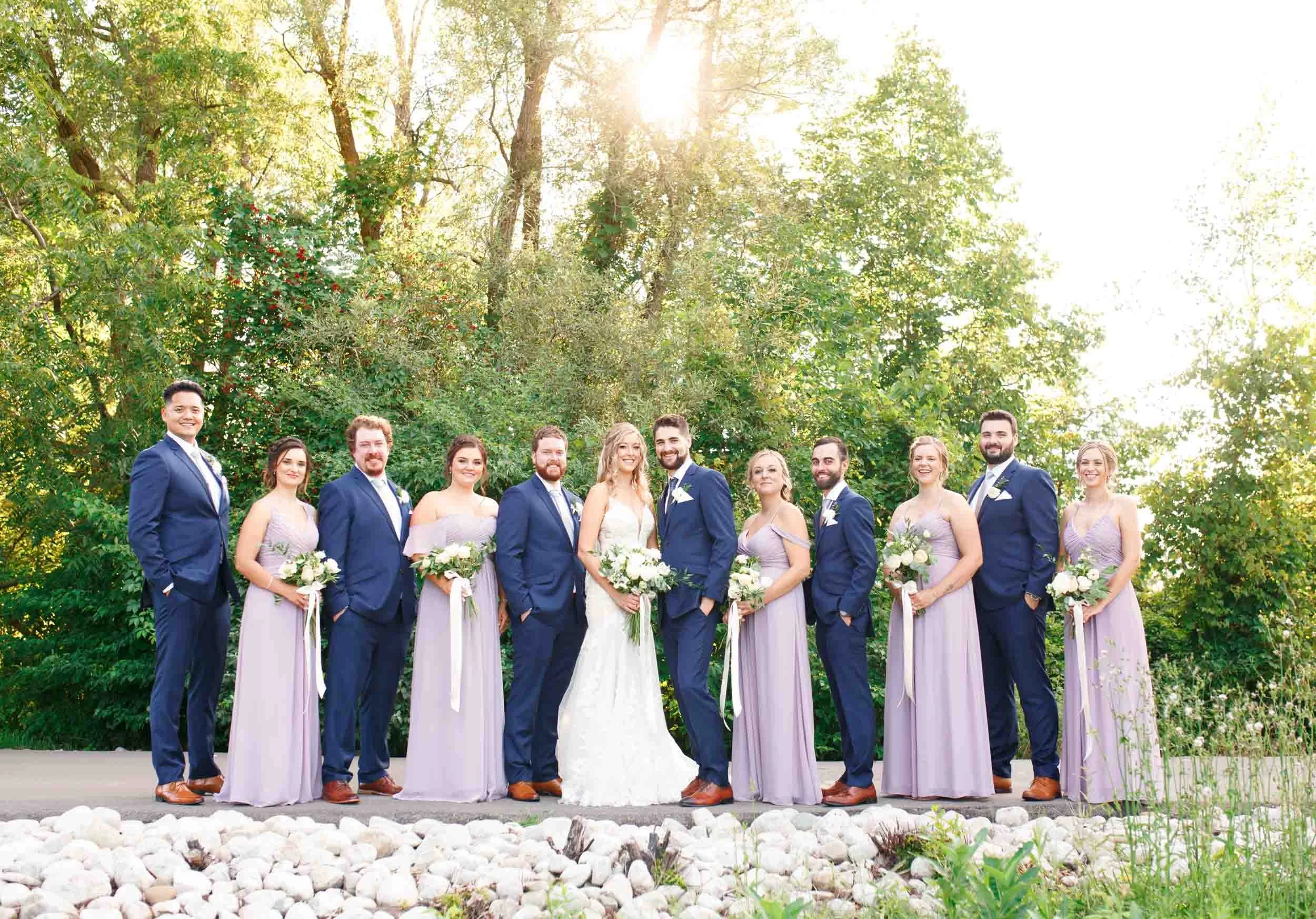 Wedding party lined up in evening light at Whistle Bear Golf Club in Cambridge, Ontario