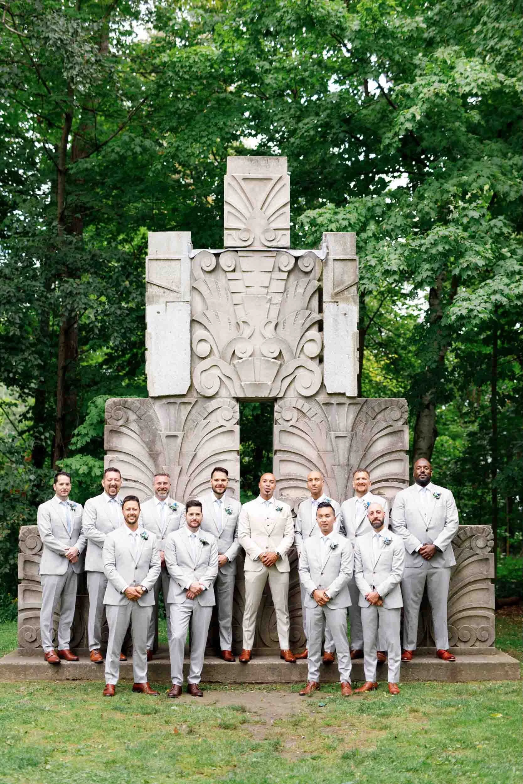 Groomsmen portrait at Guild Inn Estate historic stone monument