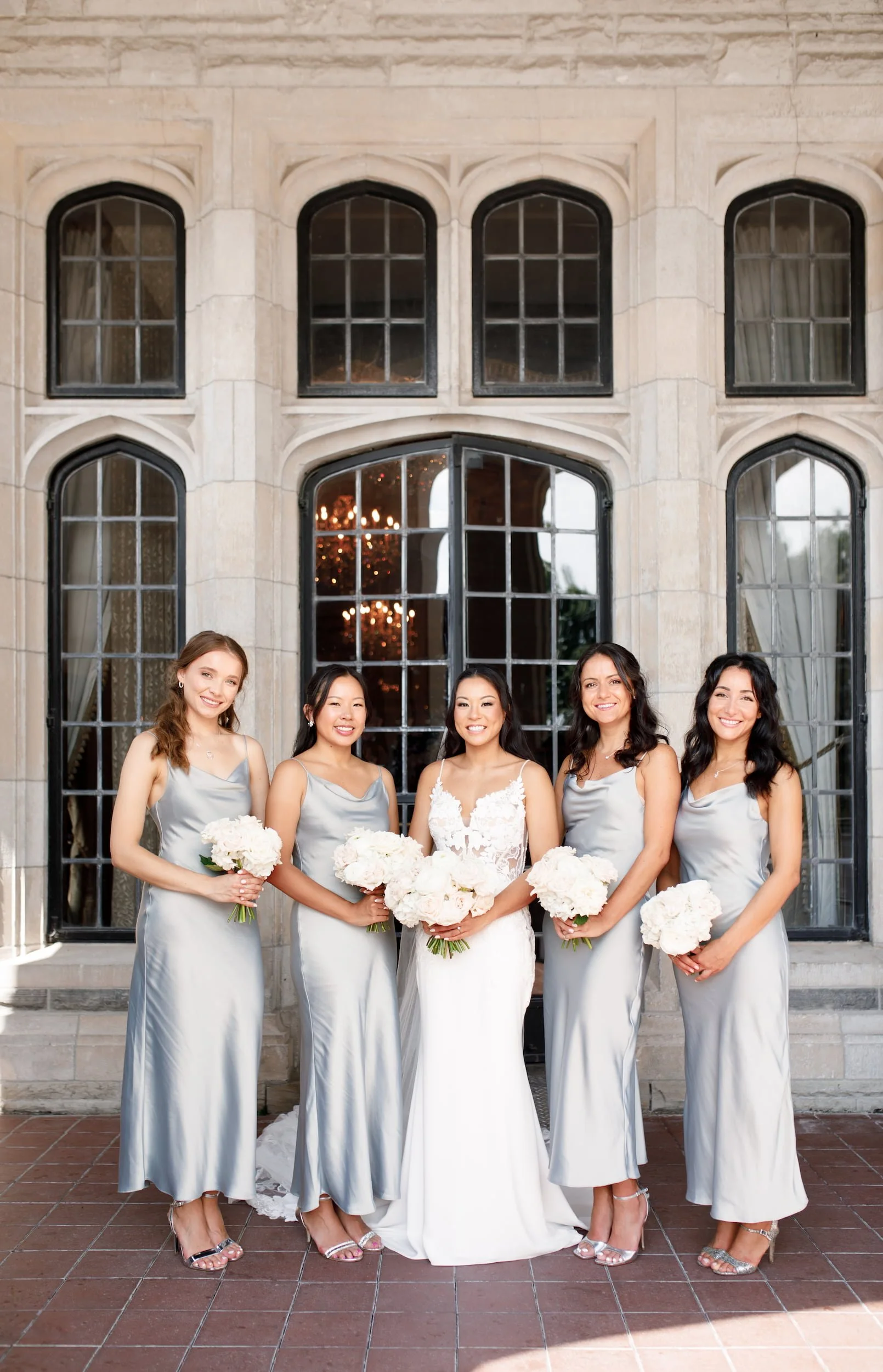 Bridesmaids portrait outside Casa Loma stone façade