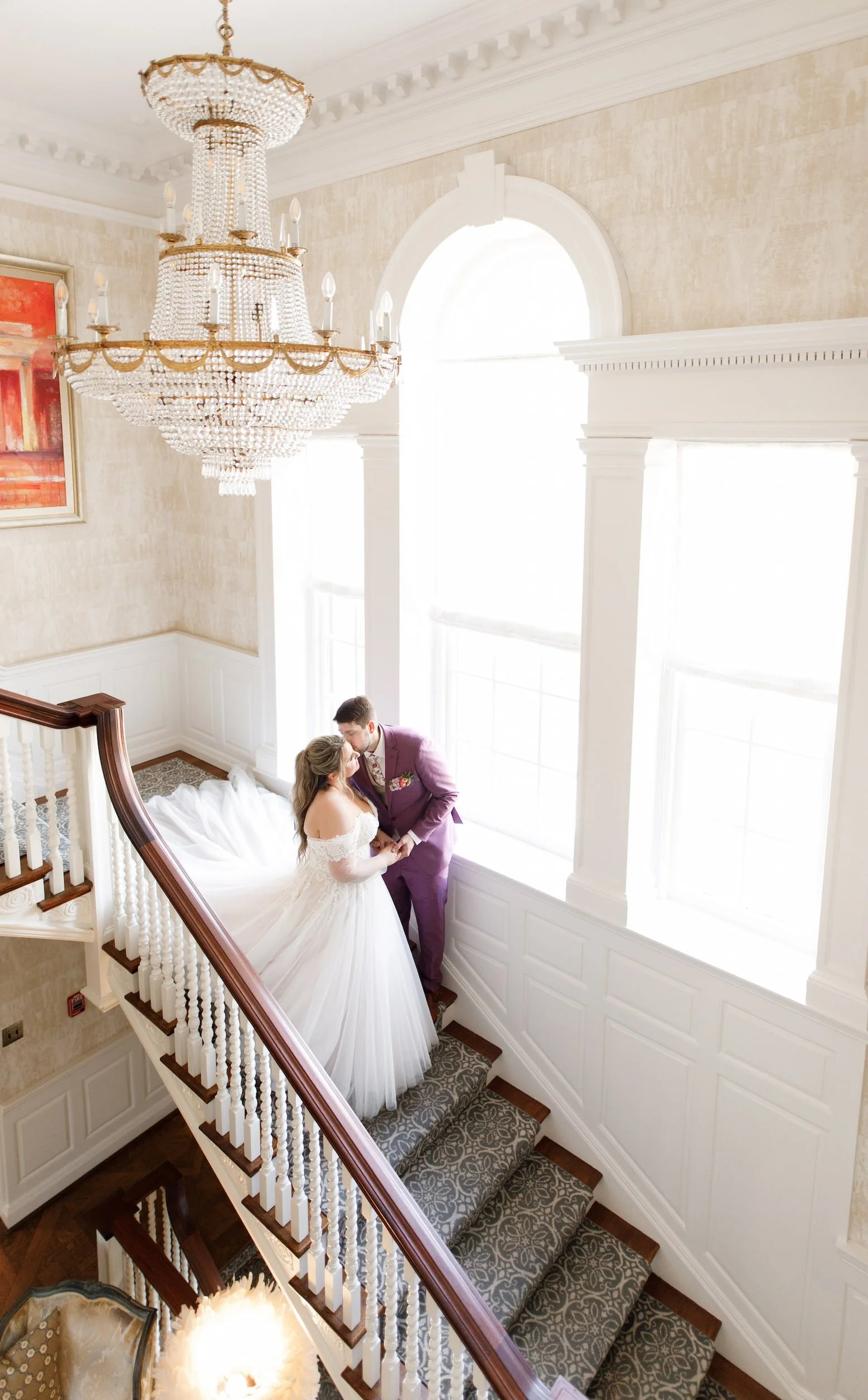 Bride and groom portrait on staircase at Graydon Hall Manor