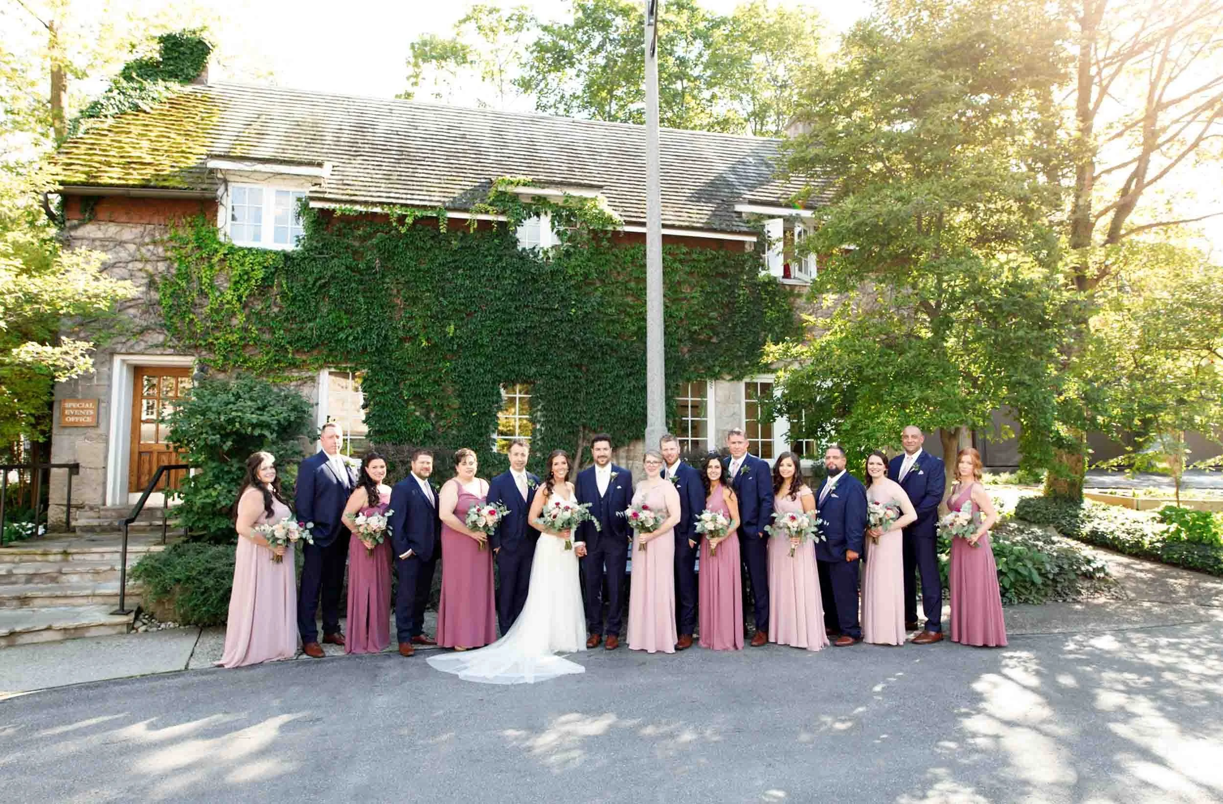 Full wedding party portrait outside the Ancaster Mill in Ancaster
