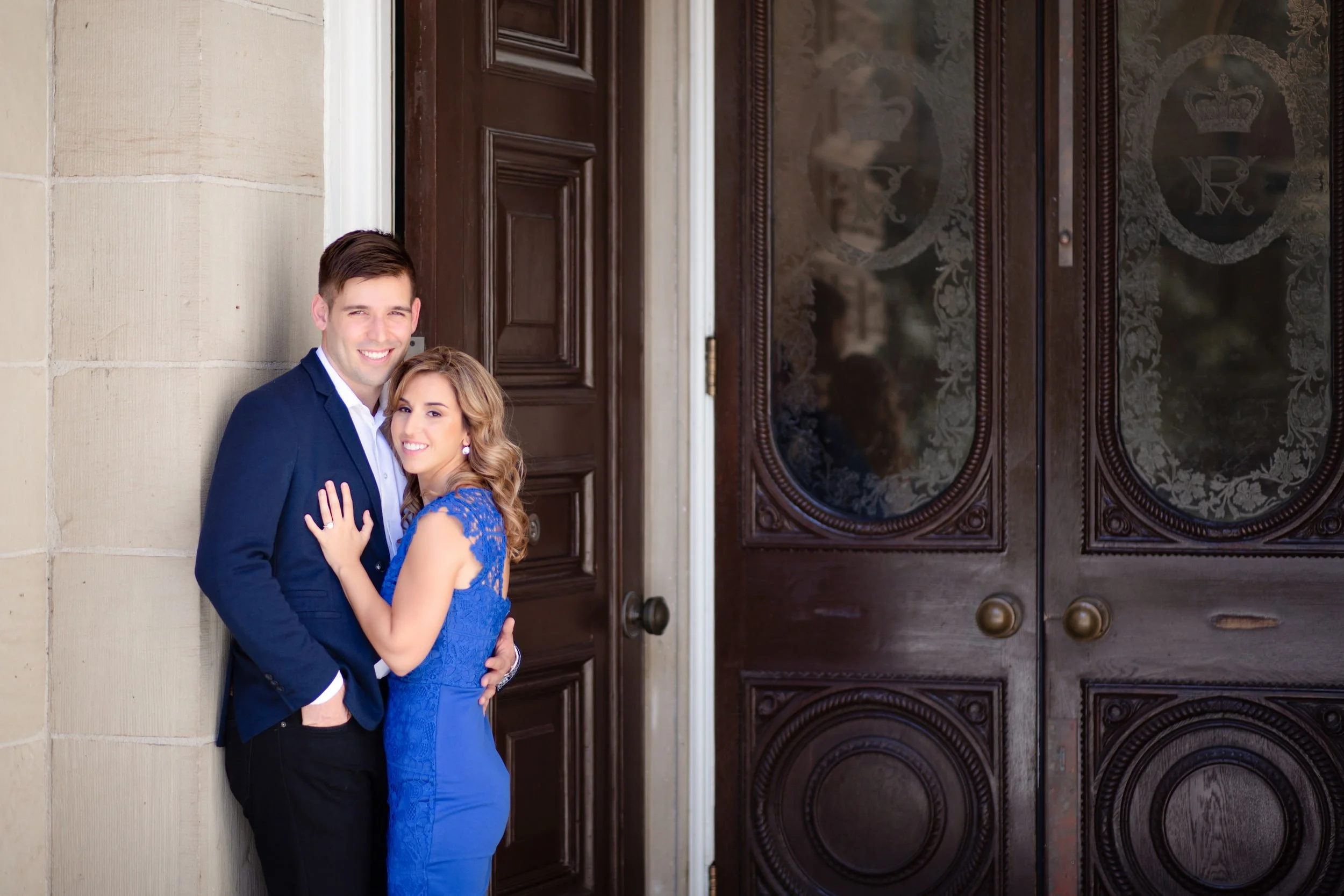 Engagement portrait at historic courthouse doorway at Osgoode Hall
