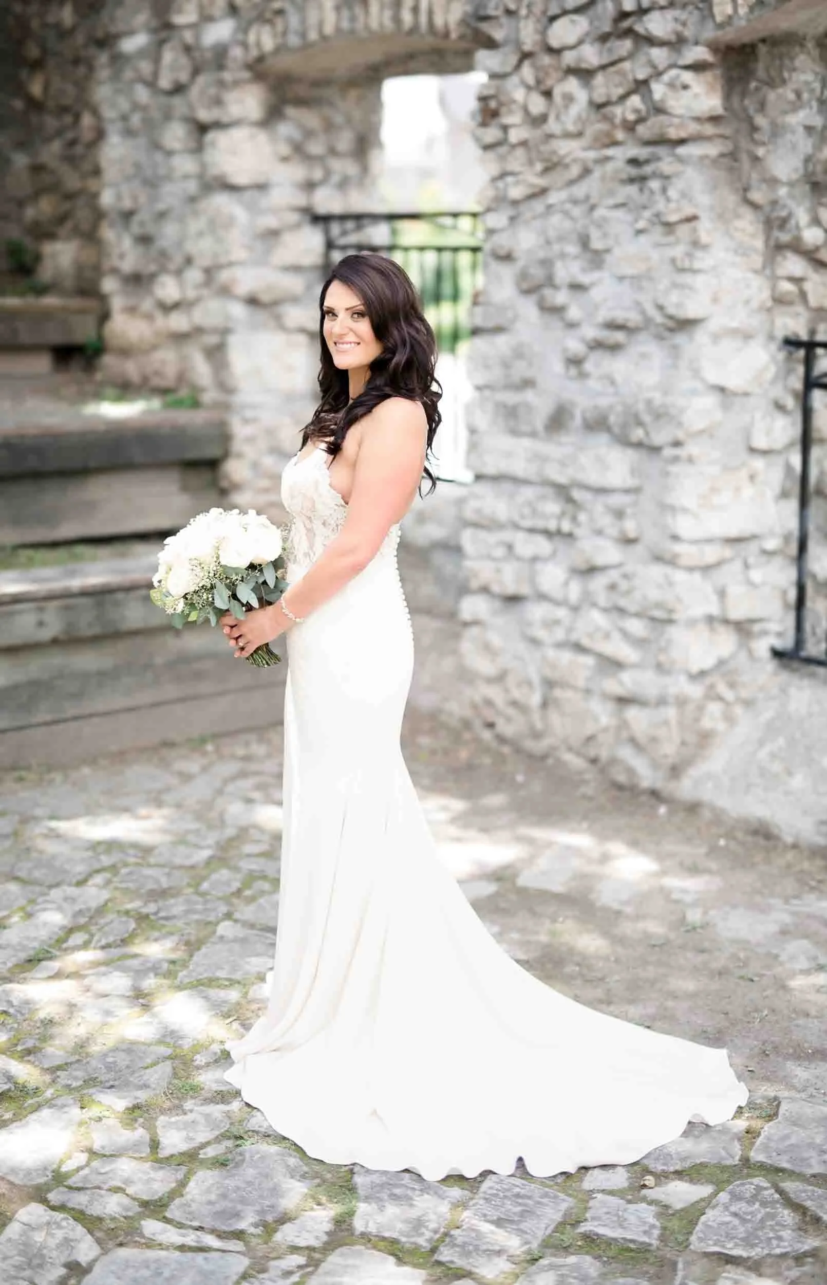 Bridal portrait against Mill Race Park limestone ruins at Cambridge Mill wedding venue