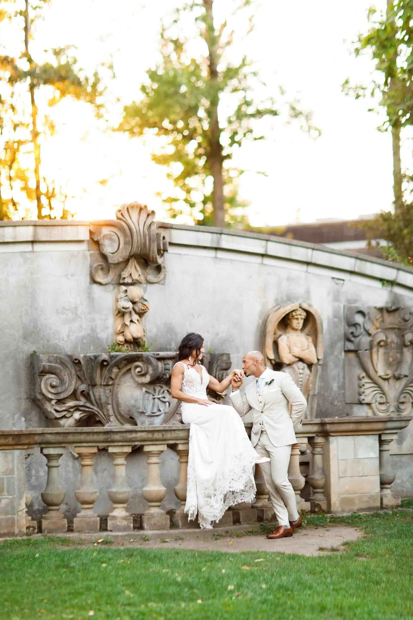 Bride and groom sunset portrait at stone facade at Guild Inn Estate in Scarborough