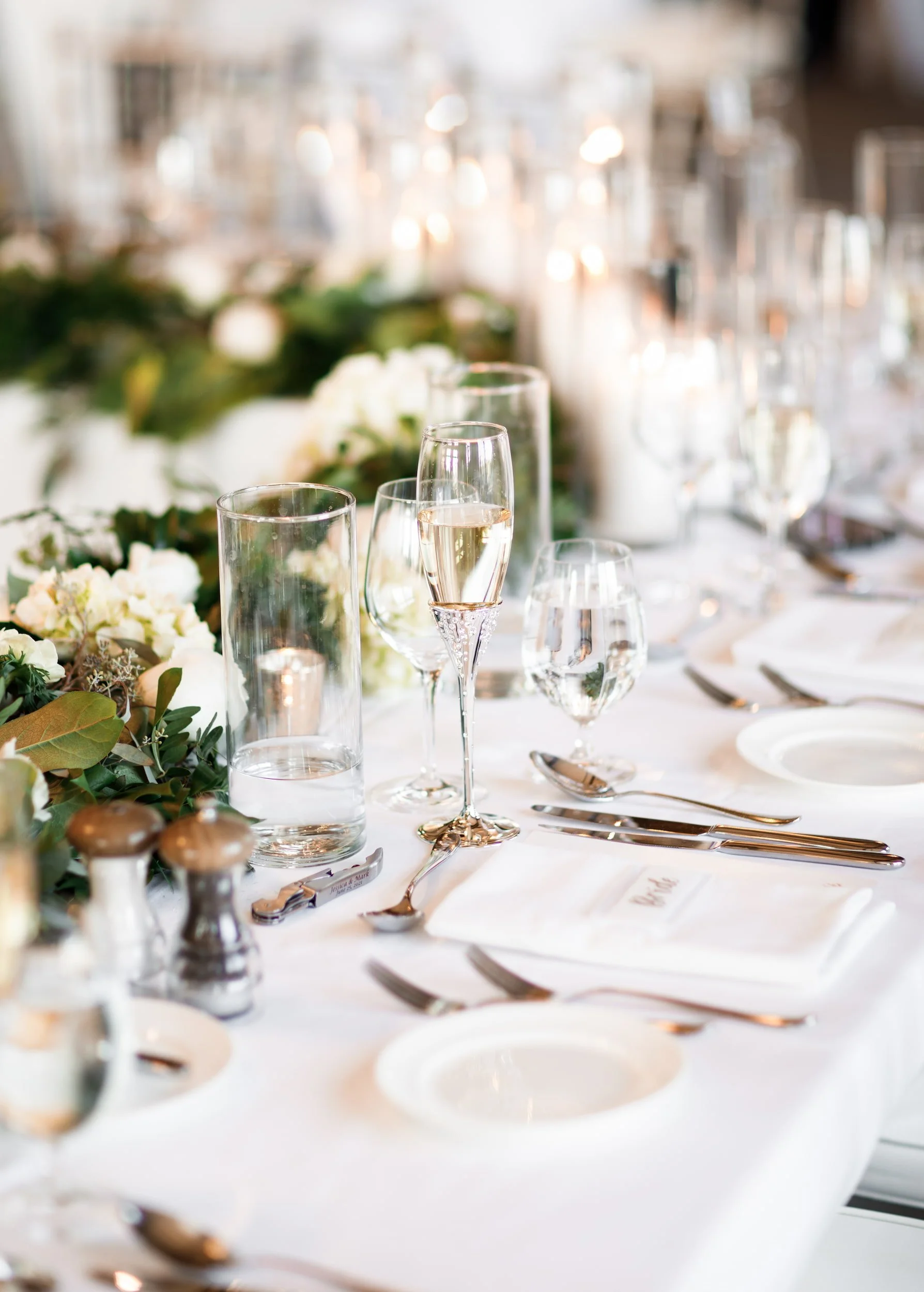 Elegant reception table details with florals and glassware at Whistle Bear Golf Club wedding in Cambridge, Ontario