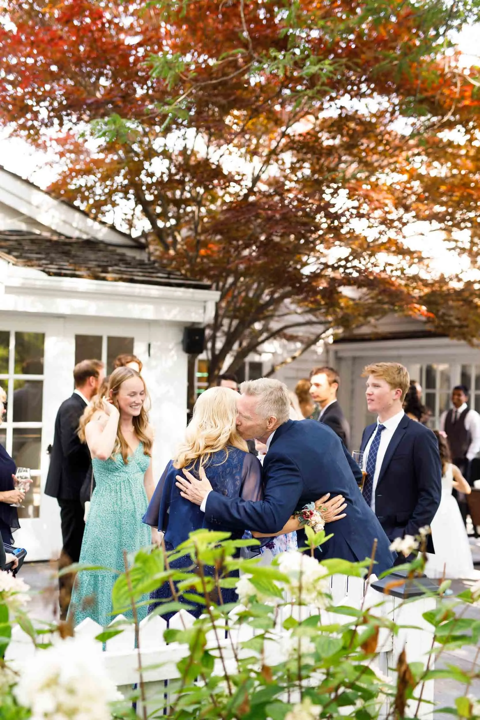Outdoor cocktail hour in heritage garden courtyard at The Doctor’s House in Kleinburg, Ontario