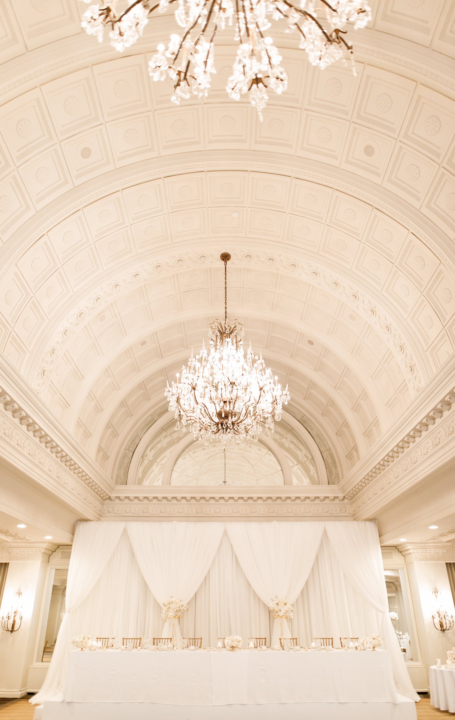 Ornate chandelier ceiling in the Vanity Fair Ballroom at Omni King Edward Hotel