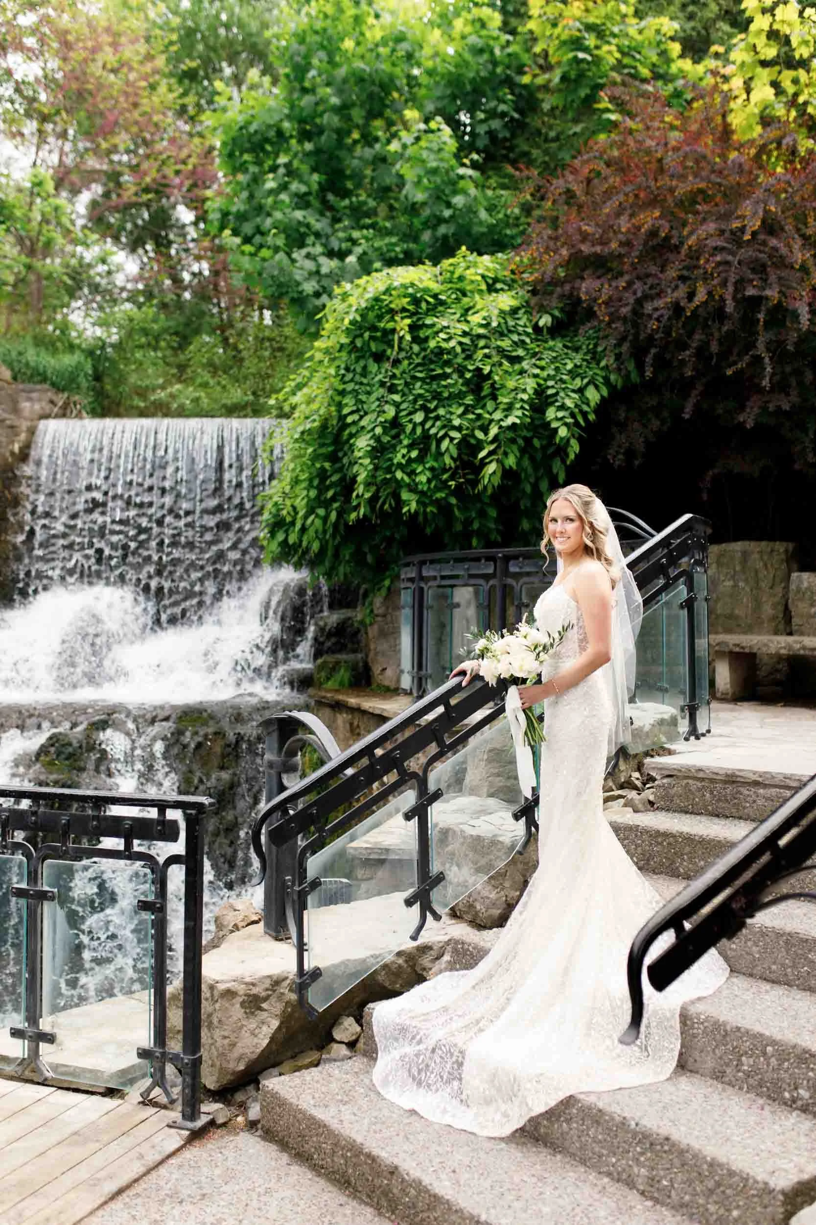 Bride portrait by the waterfall at the Ancaster Mill in Ancaster