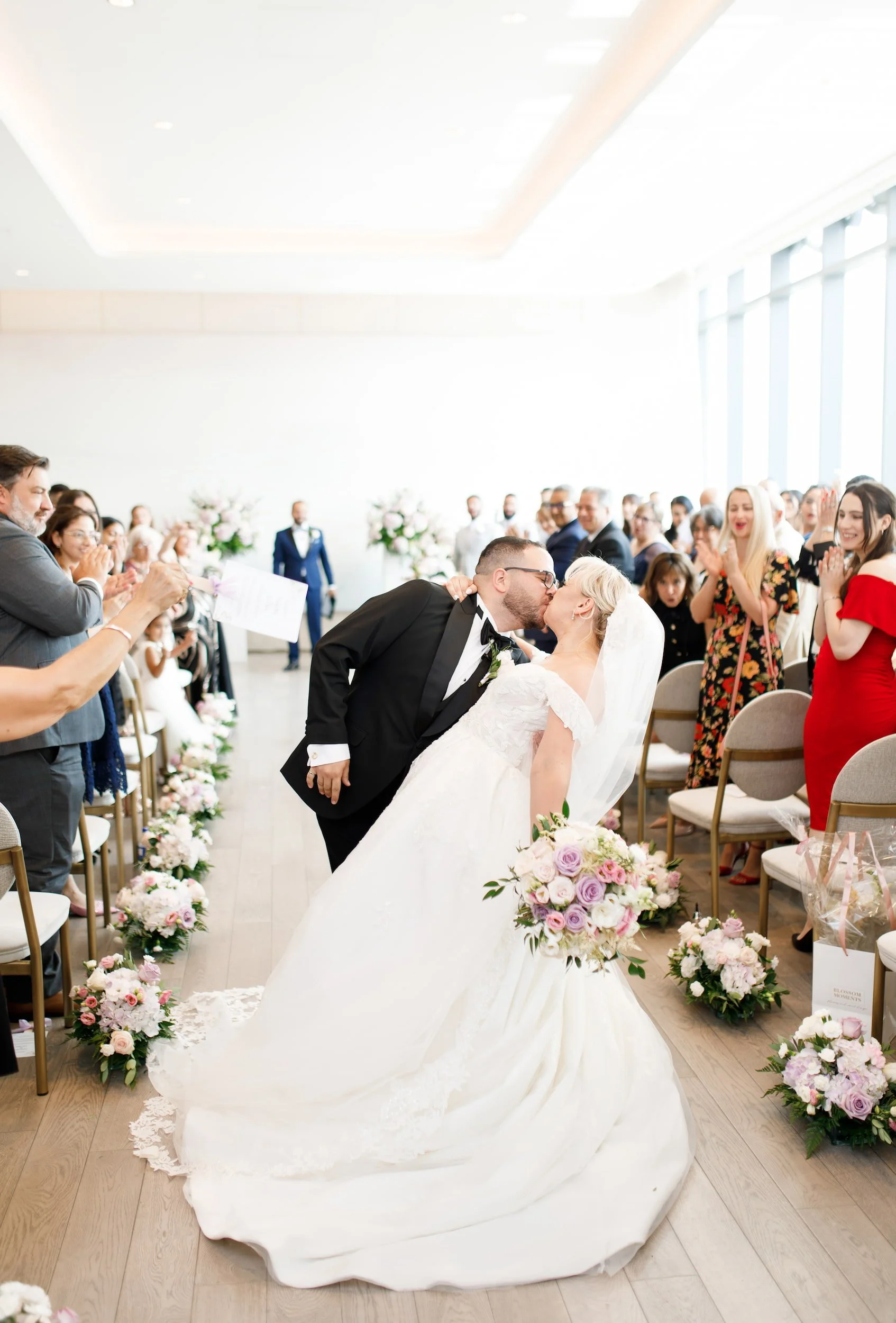 Celebratory dip during ceremony recessional at The Pearle Hotel wedding in Burlington