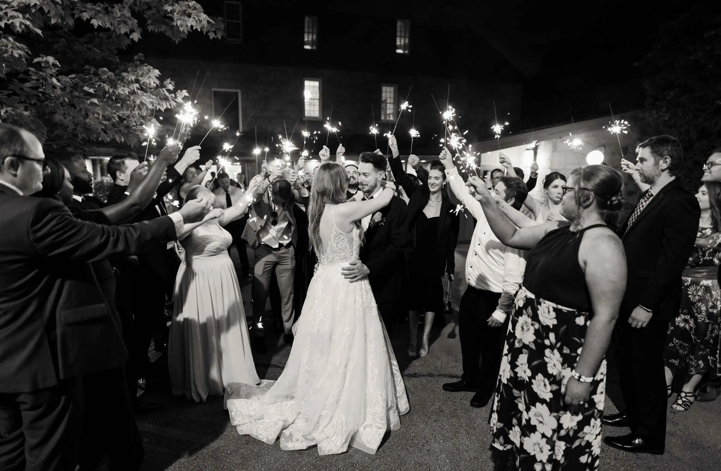 Black and white sparkler send-off final dance at night outside the Ancaster Mill