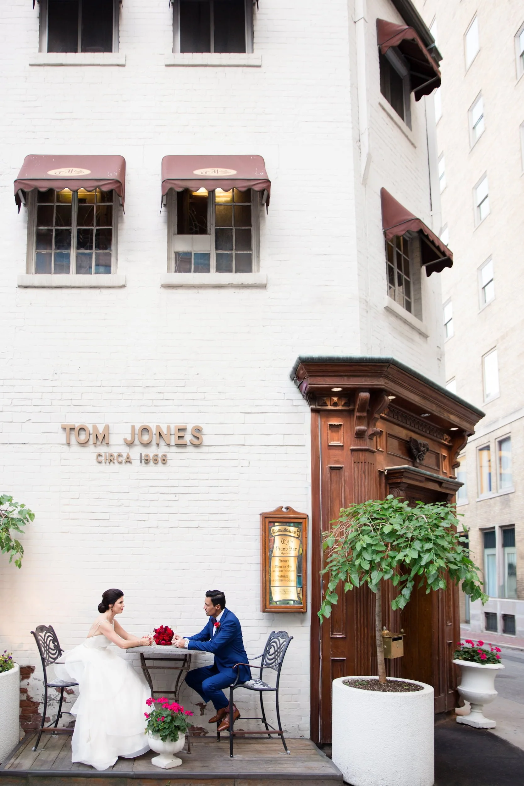 Bride and groom portrait outside historic Tom Jones Steakhouse near Omni King Edward Hotel in Toronto