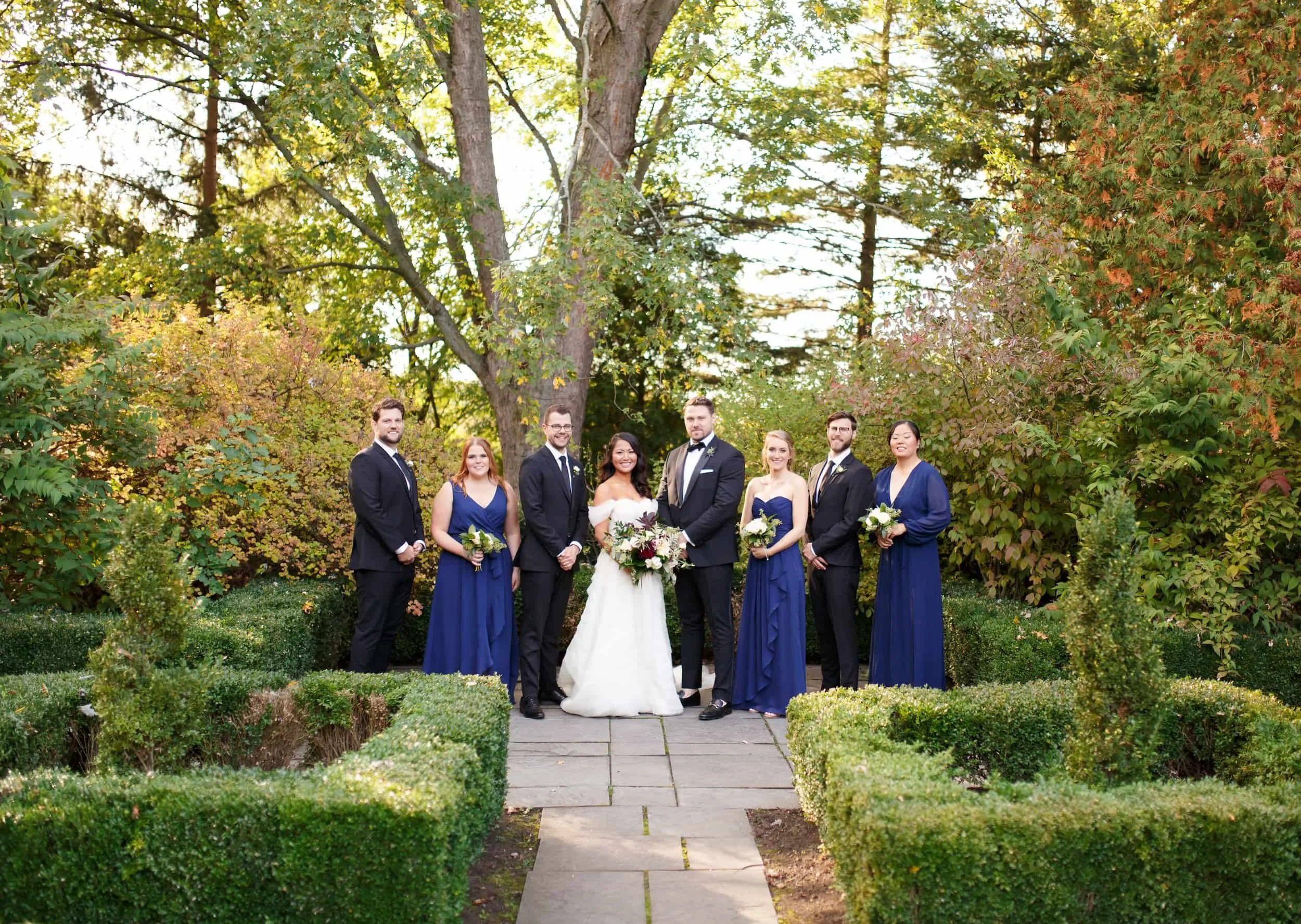 Wedding party portrait in formal garden at Gracewood Estate