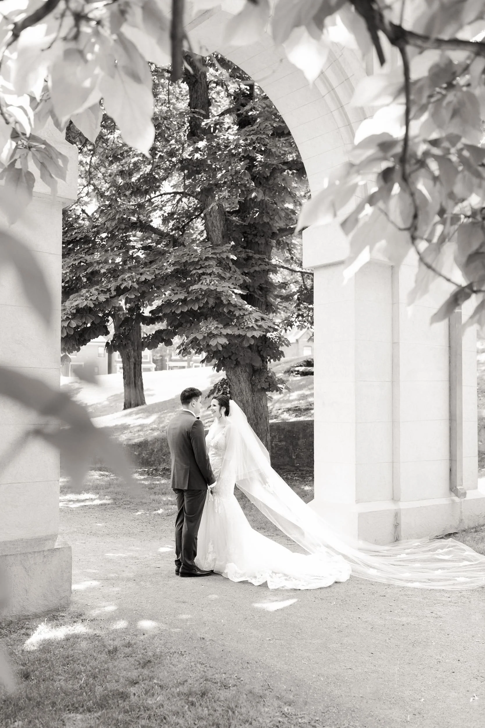 Black and white bridal portrait beneath Dundurn Castle columns