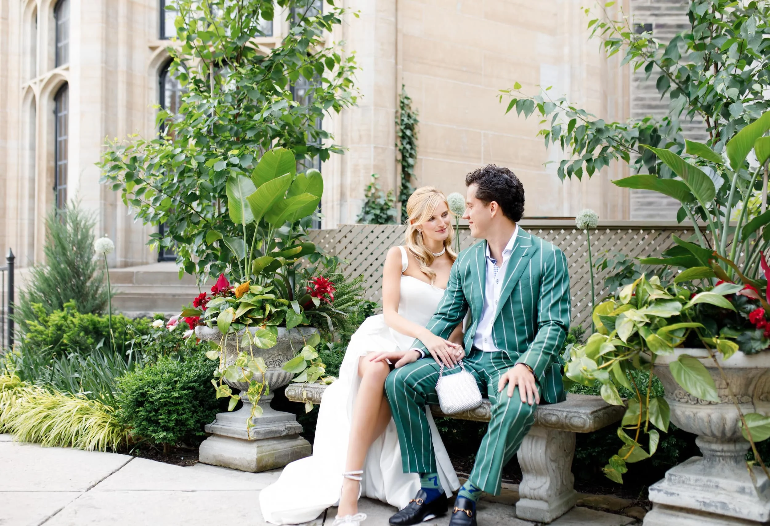 Romantic portrait with greenery in the Casa Loma courtyard