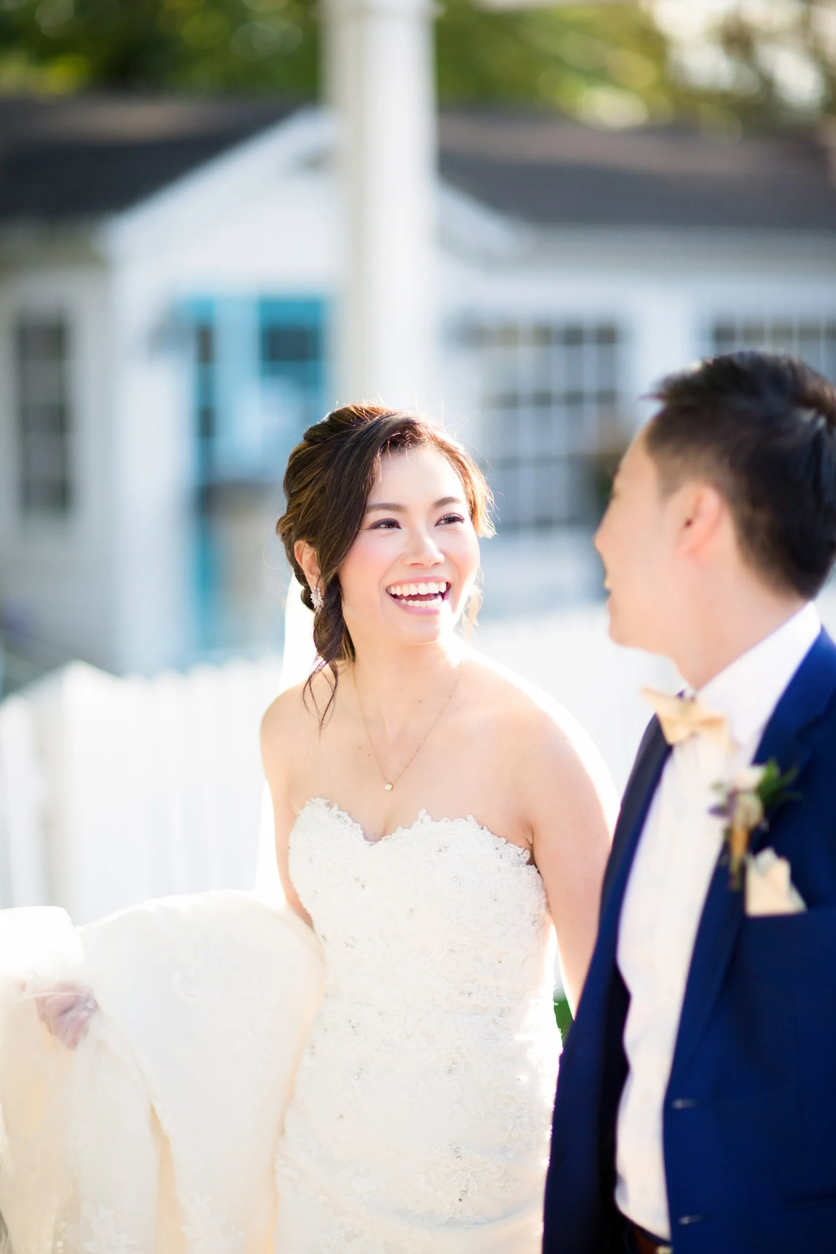 Bride smiling during outdoor portrait session at The Doctor’s House in Kleinburg, Ontario