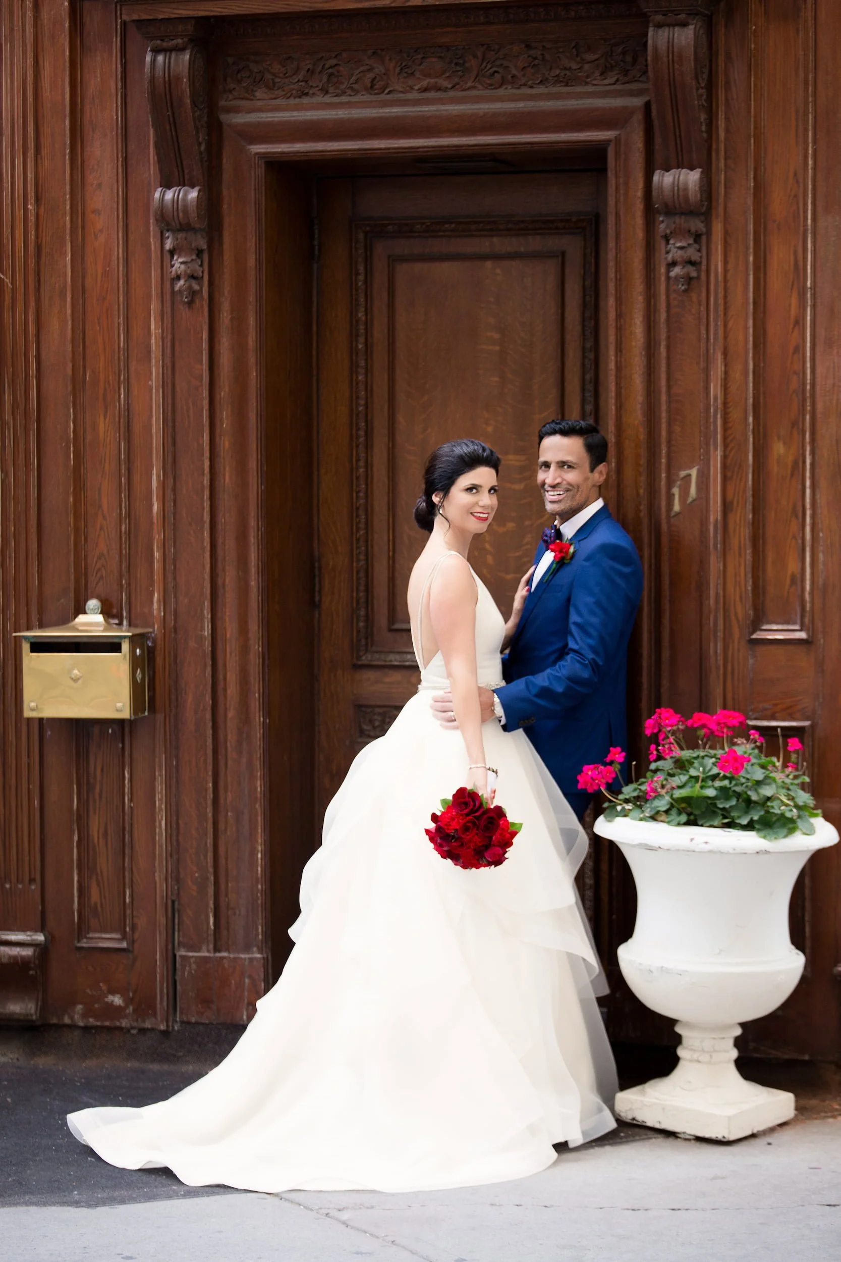 Bride and groom portrait at classic wooden entrance in downtown Toronto