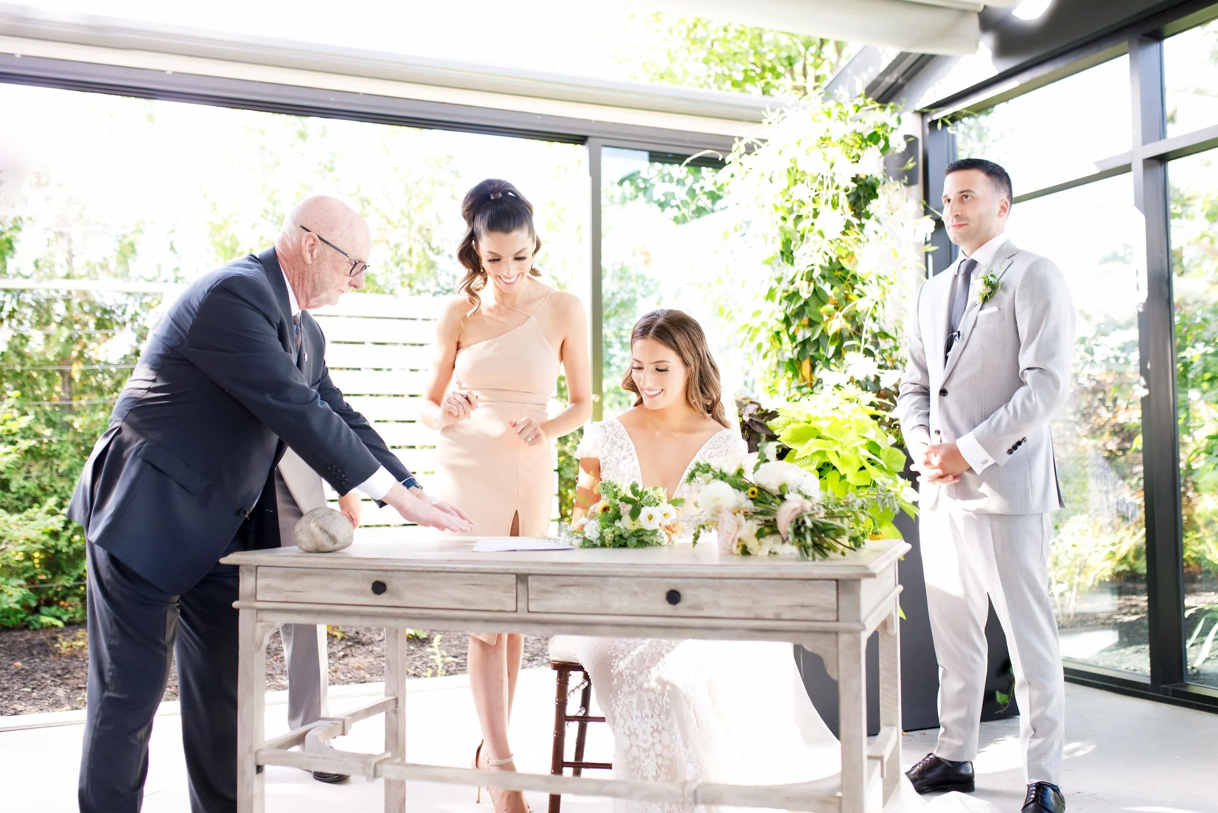 Signing of the marriage license during ceremony at Whistle Bear Golf Club in Cambridge, Ontario