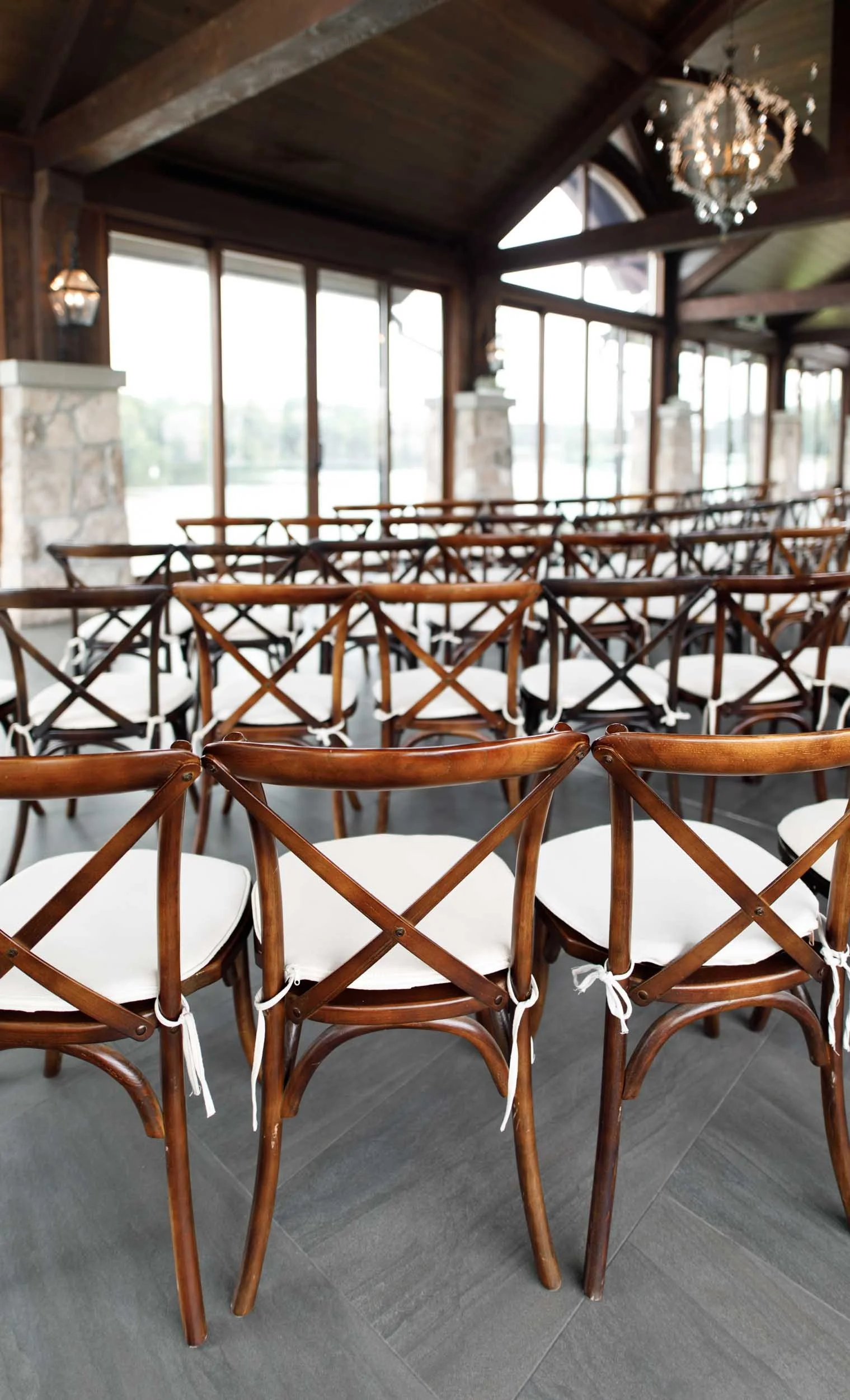 Cross-back ceremony chairs inside Cambridge Mill pavilion ceremony overlooking the Grand River