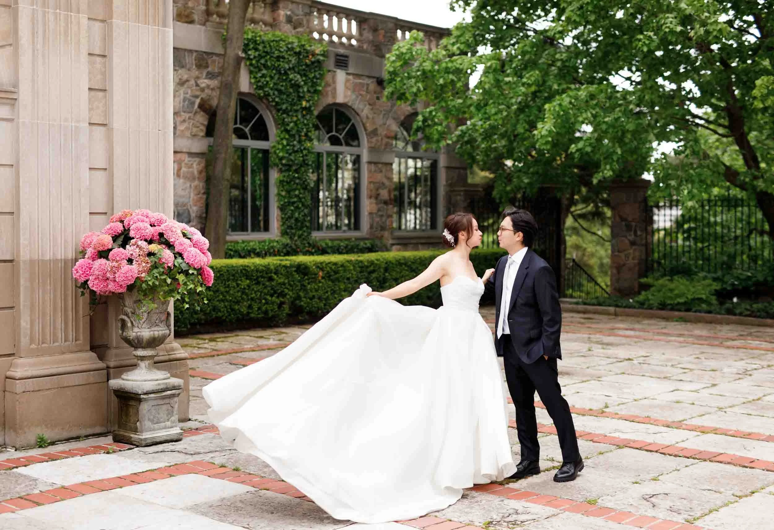 Bride twirling in courtyard at Graydon Hall Manor