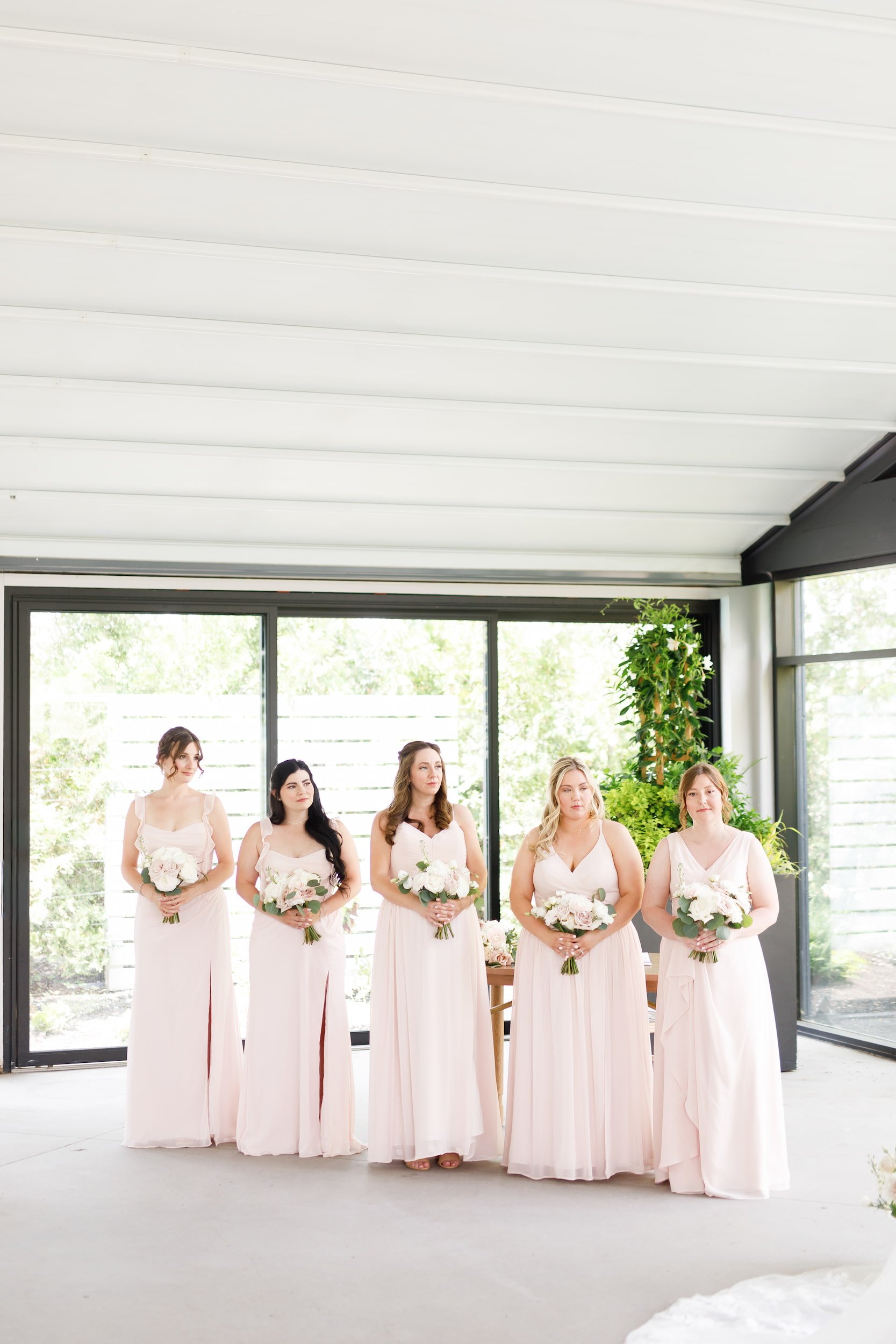 Bridesmaids lined up inside pavilion at Whistle Bear Golf Club in Cambridge, Ontario