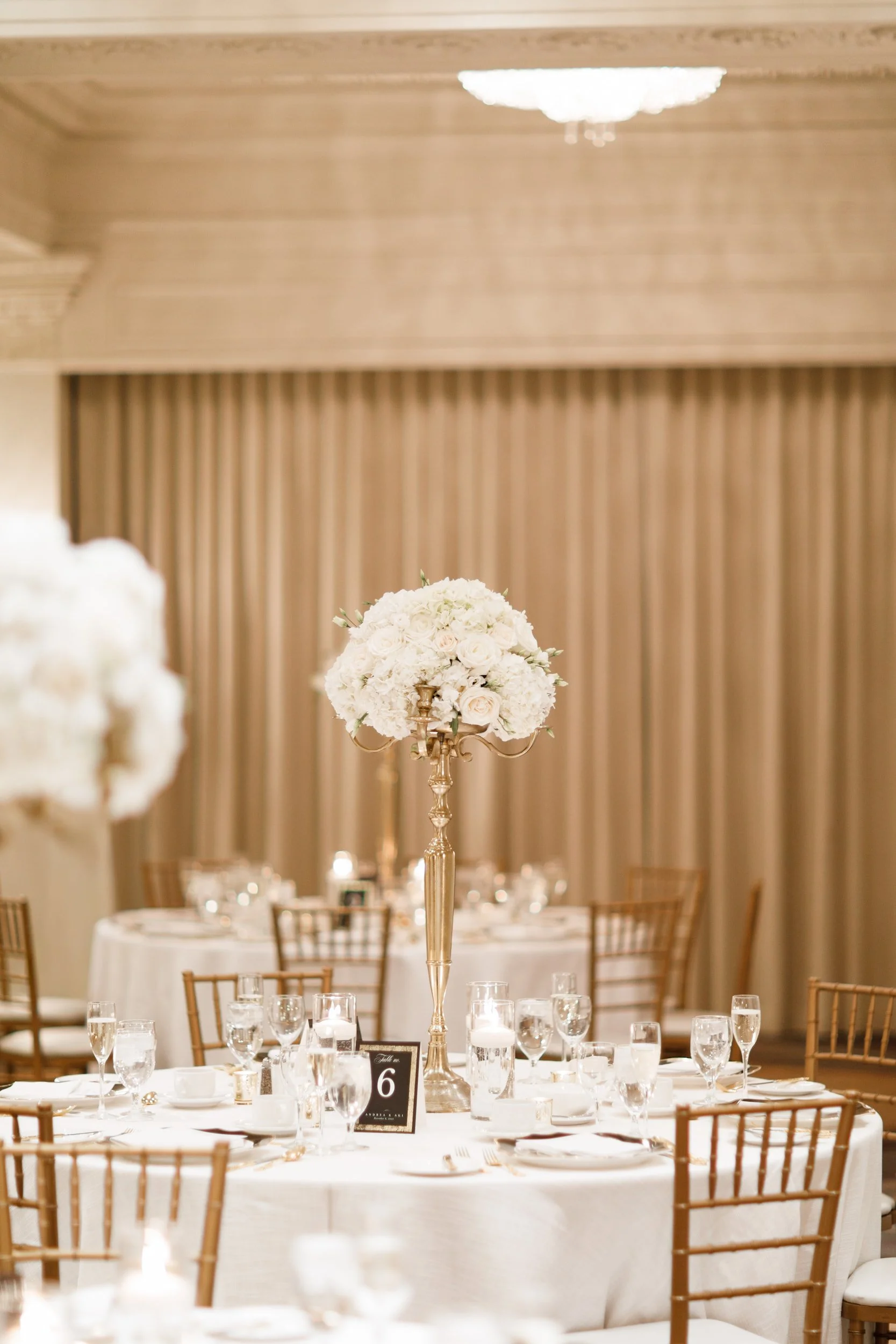 Gold floral centrepiece décor at Omni King Edward Hotel reception