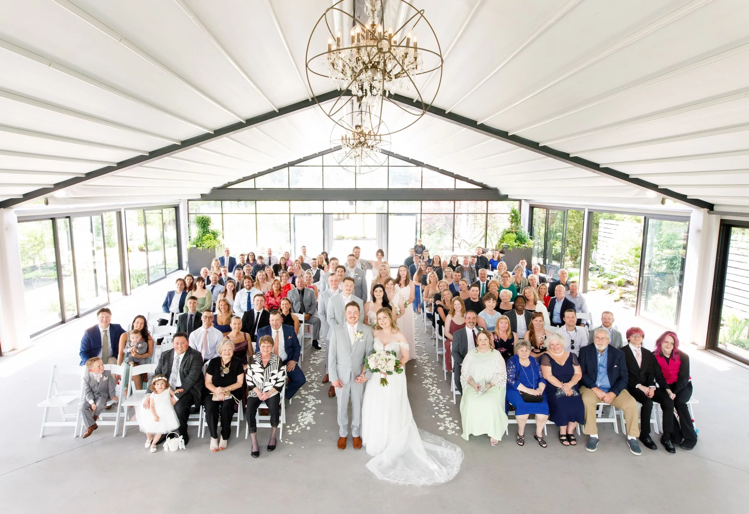 Group portrait of wedding guests inside pavilion at Whistle Bear Golf Club wedding in Cambridge, Ontario