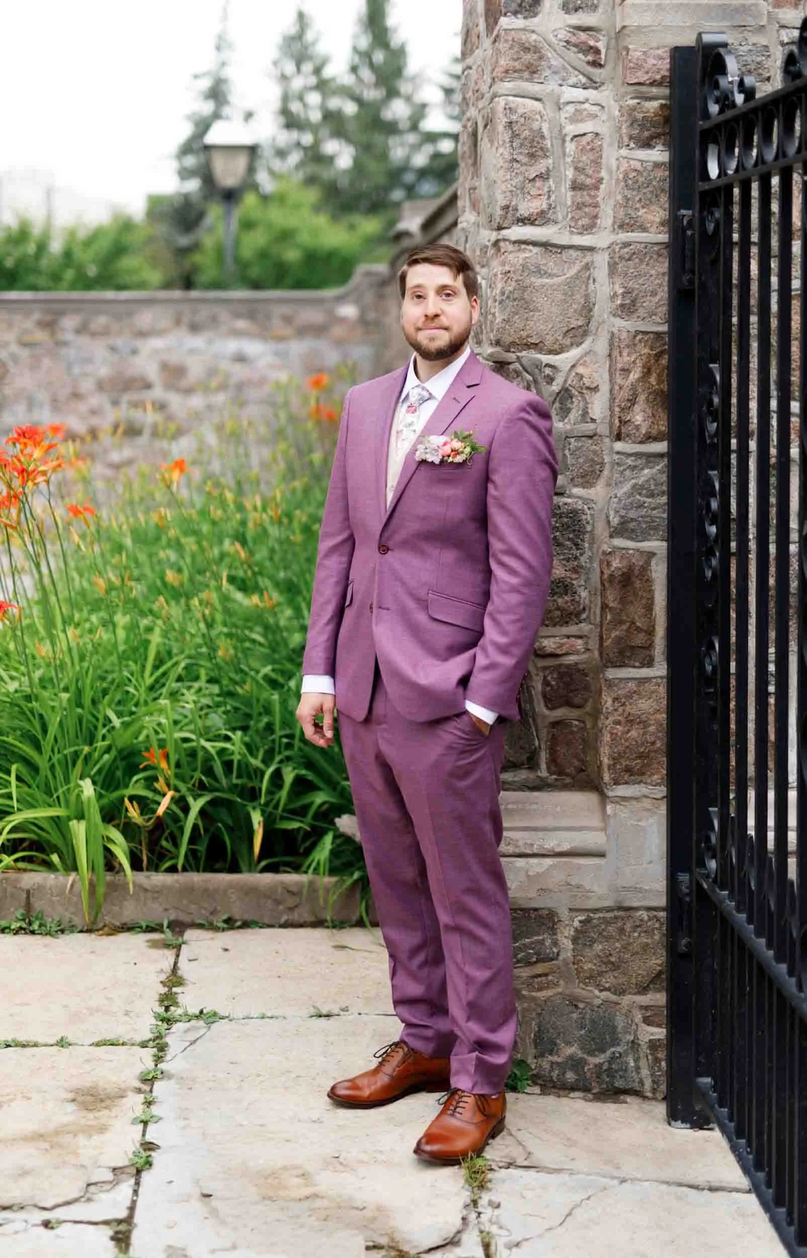 Groom portrait in mauve suit at Graydon Hall Manor