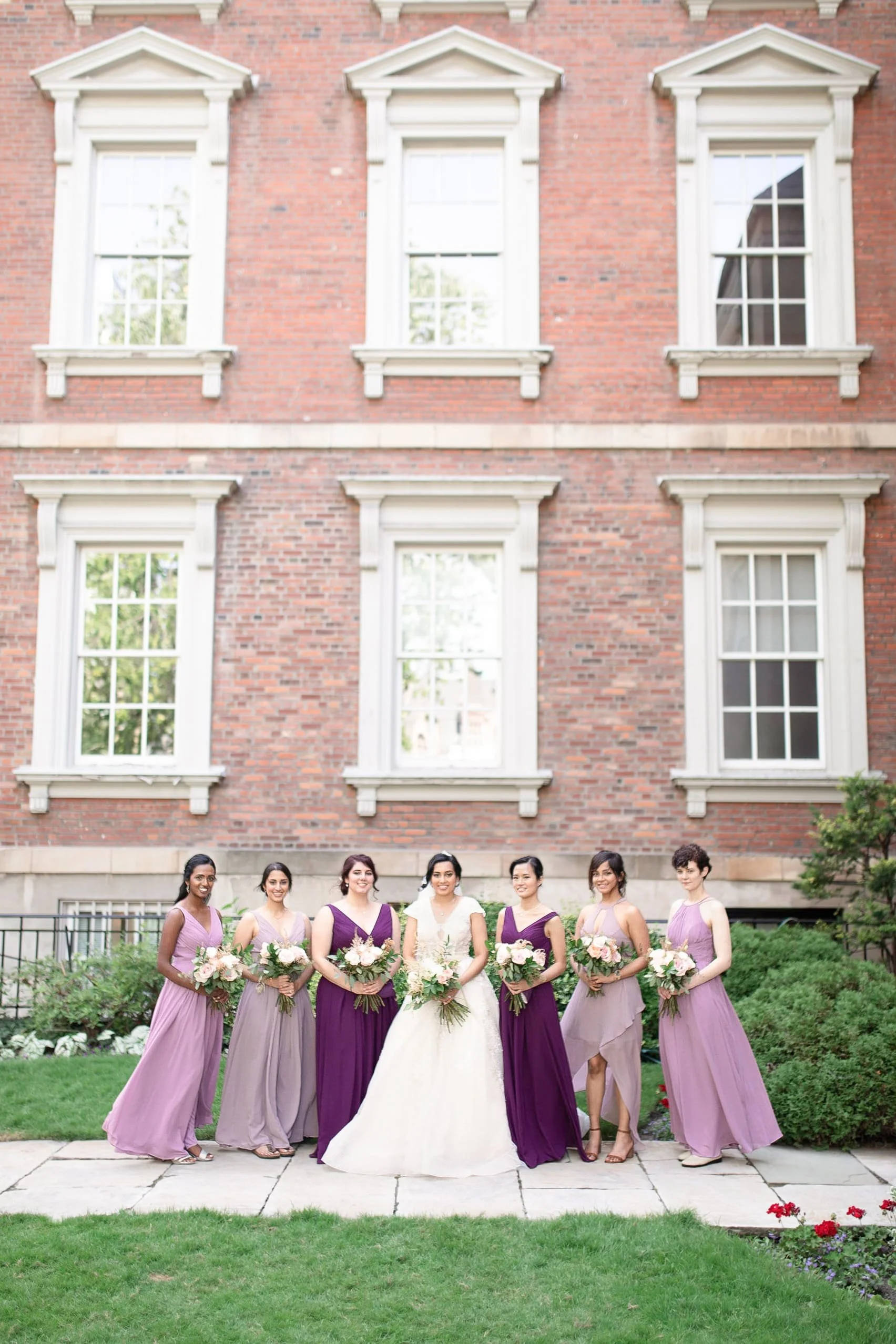 Bridesmaids portrait in garden courtyard at Osgoode Hall in Toronto