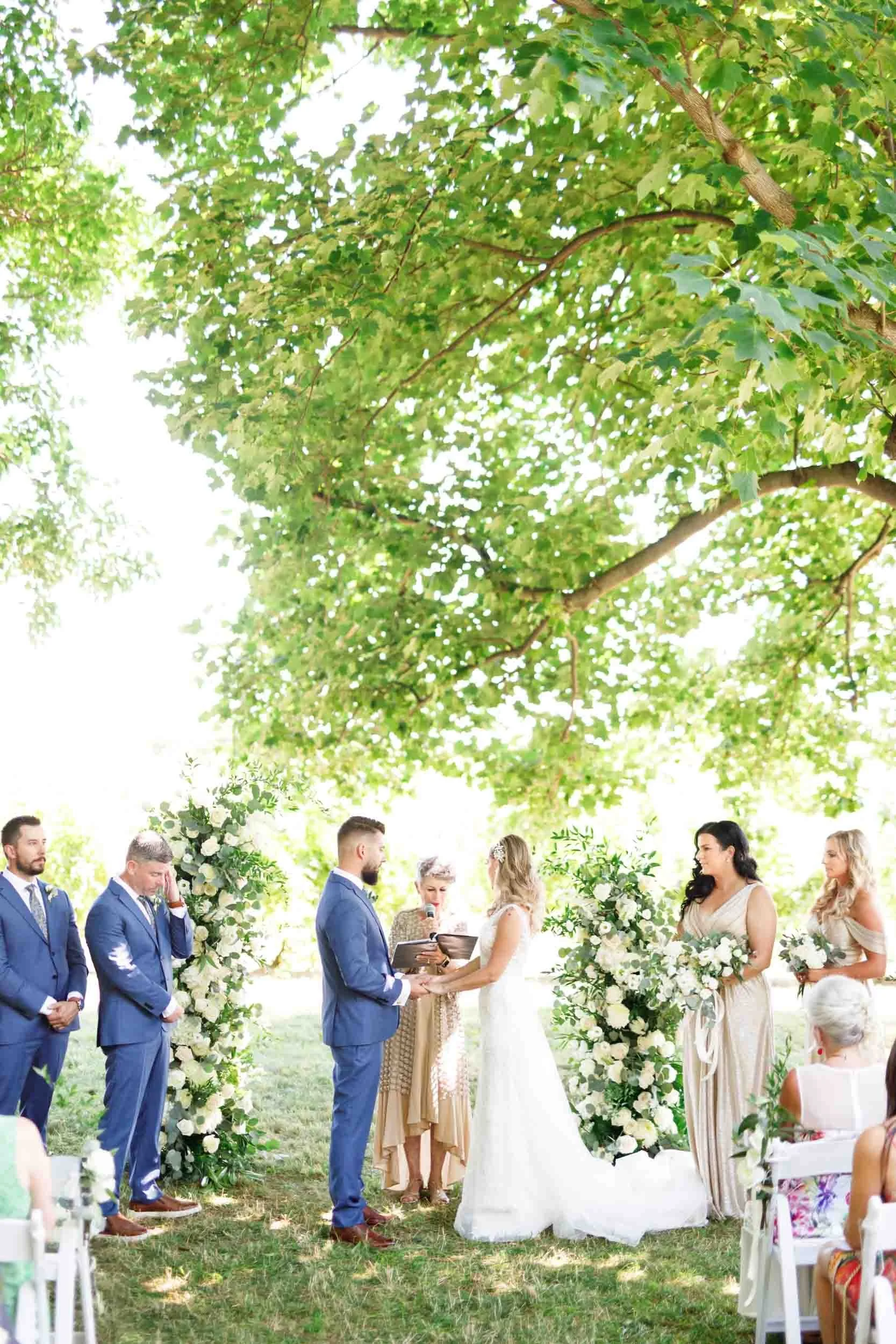 Outdoor ceremony beneath trees at Gracewood Estate in Niagara wine country