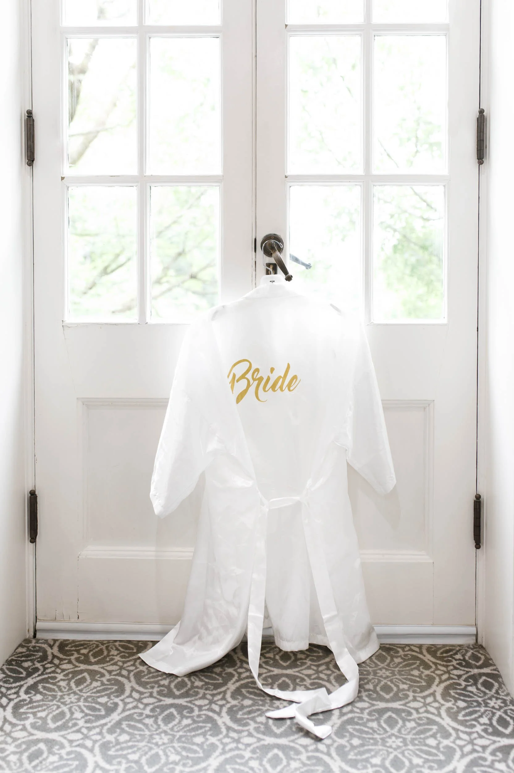 Bride robe hanging in window at Graydon Hall Manor