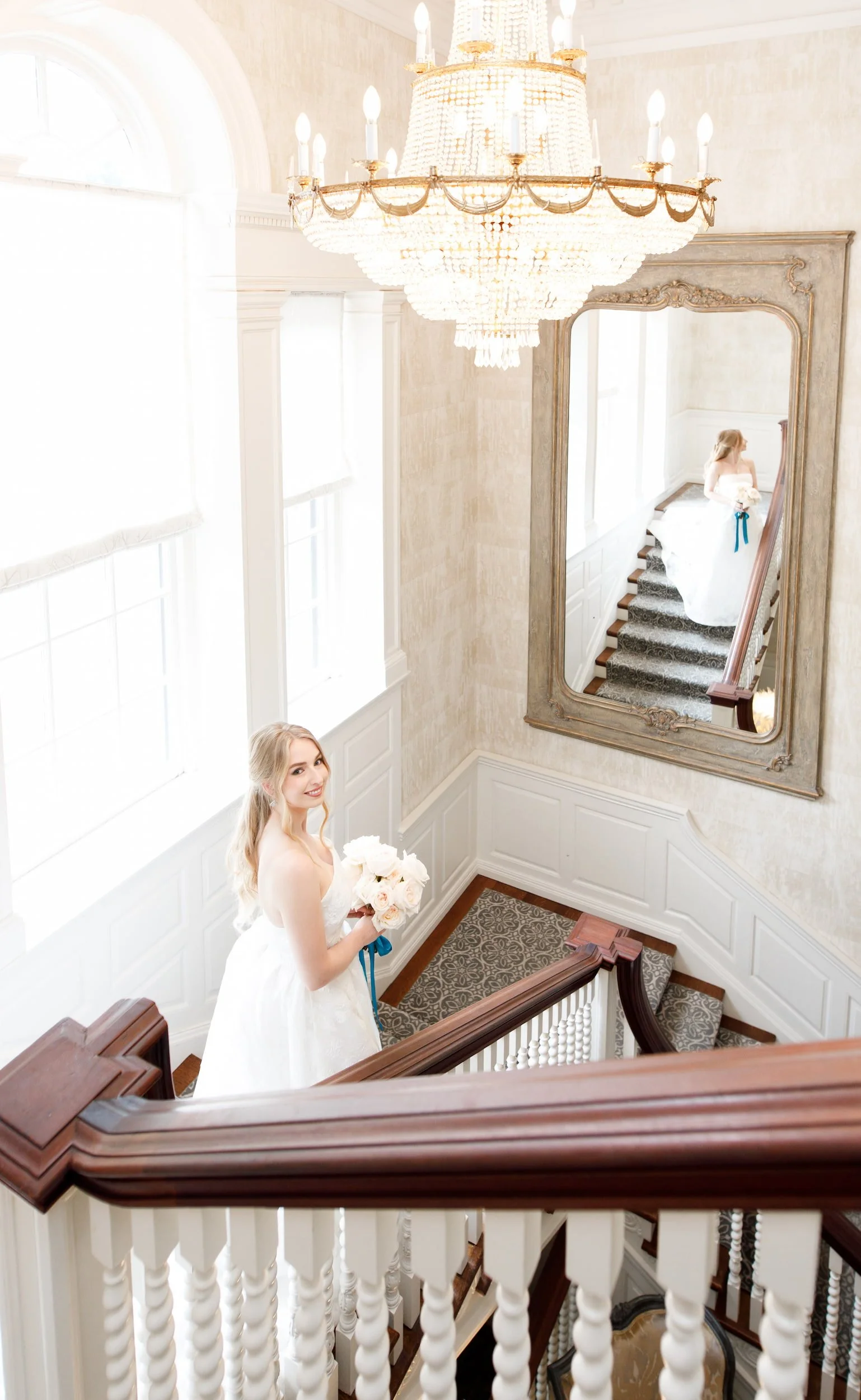 Bride on staircase at Graydon Hall Manor in Toronto