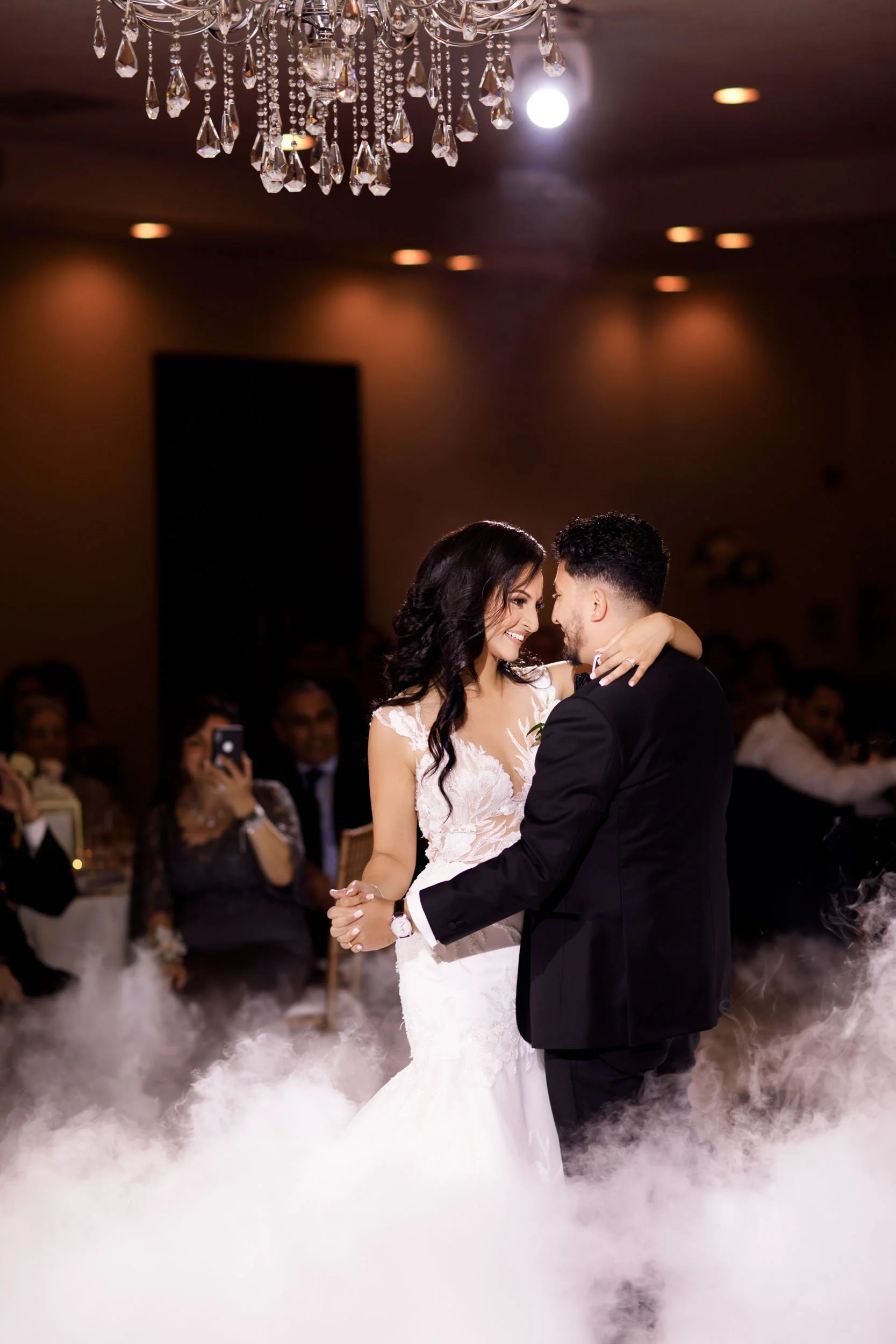 Intimate slow dance during evening reception at The Manor Event Venue wedding in King, Ontario