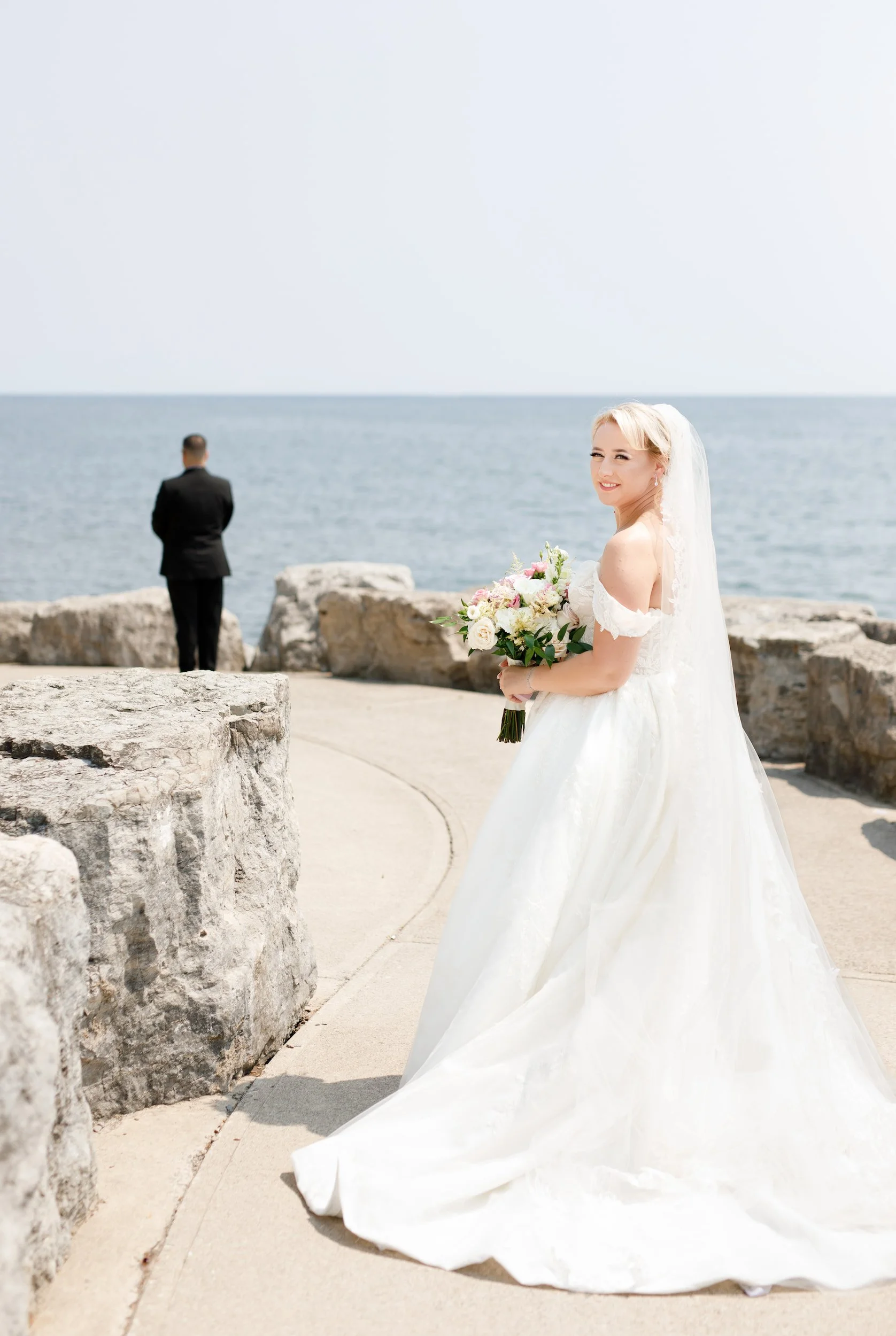 Bride portrait before first look along Lake Ontario shoreline near The Pearle Hotel in Burlington