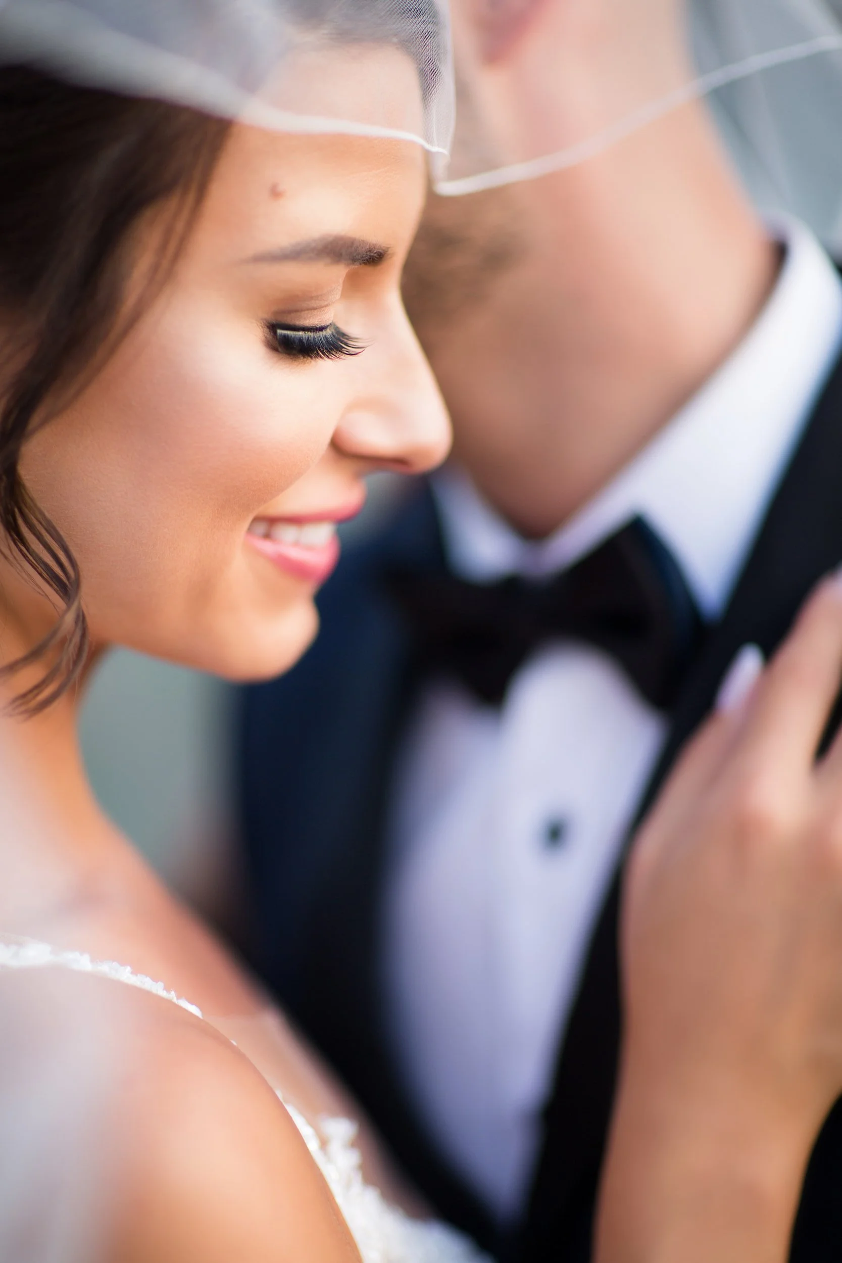 Intimate close up of bride and groom embracing outdoors during wedding portraits at Hacienda Sereda in Kitchener-Waterloo, Ontario