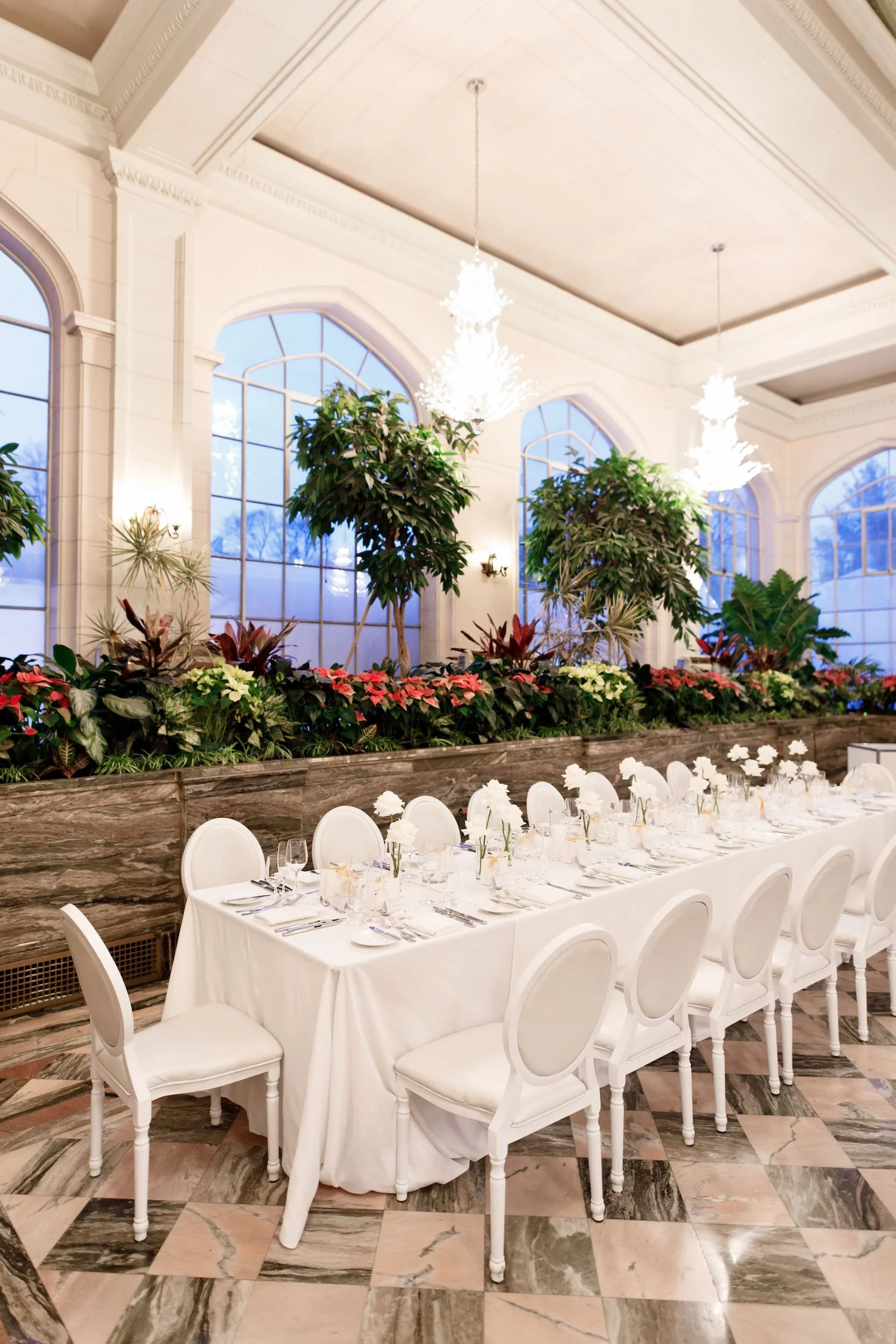 Wedding reception tables inside the Casa Loma Conservatory