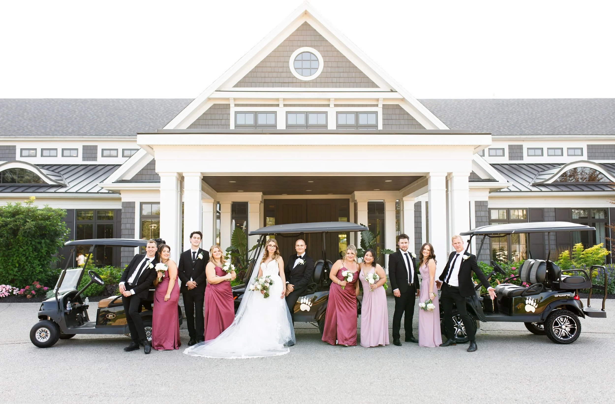 Wedding party portrait in front of clubhouse at Whistle Bear Golf Club in Cambridge, Ontario