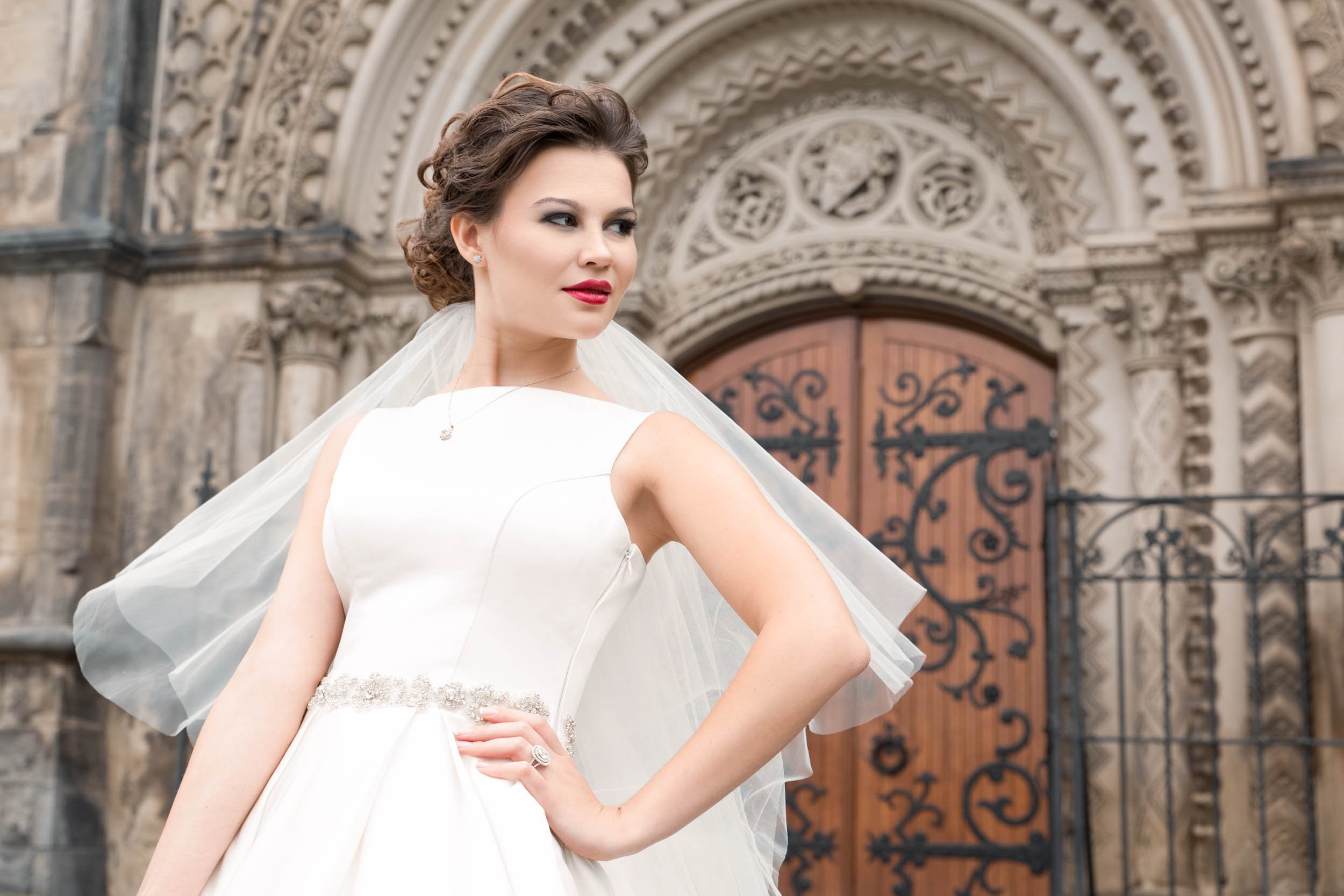 Bridal portrait with ornate carved doorway at Knox College, University of Toronto in Toronto, Ontario