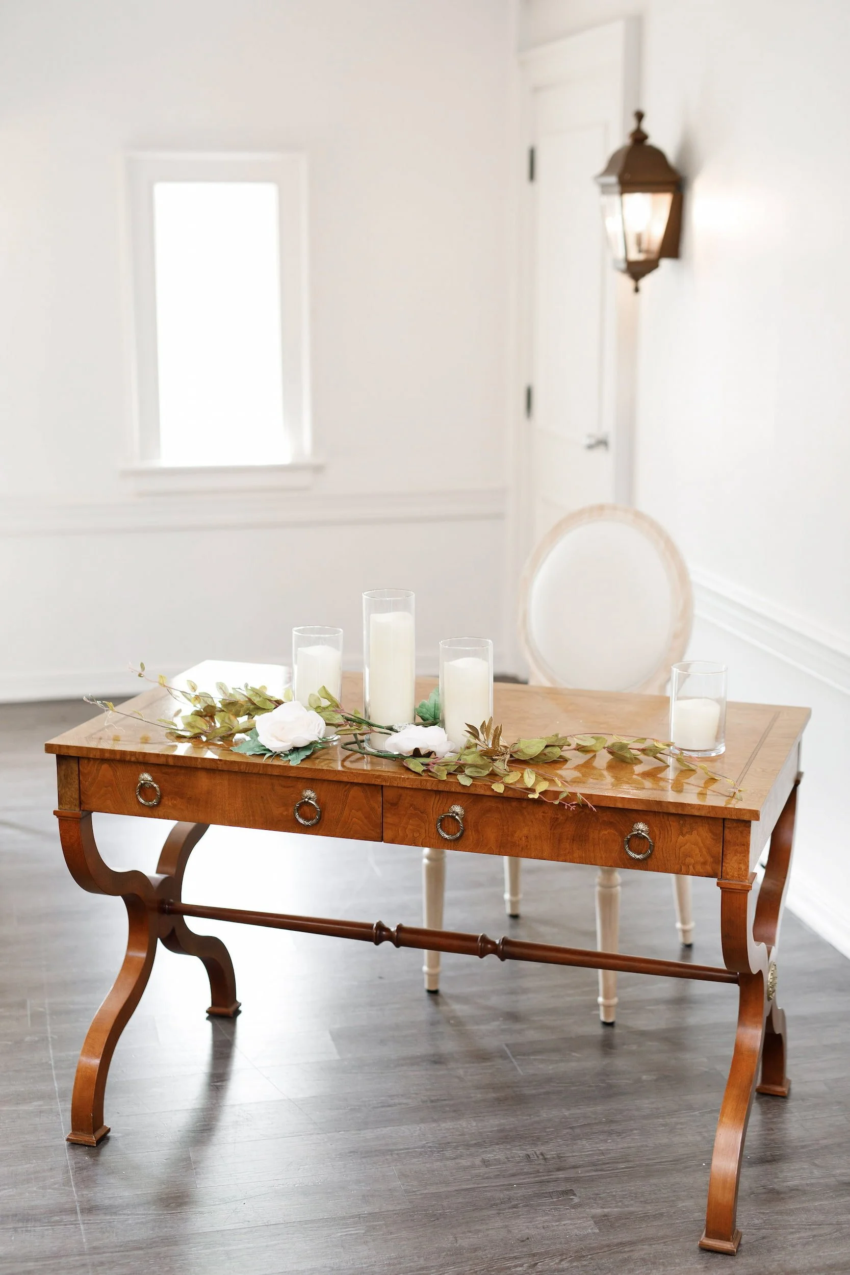 Vintage signing table with candles inside The Doctor’s House chapel in Kleinburg, Ontario