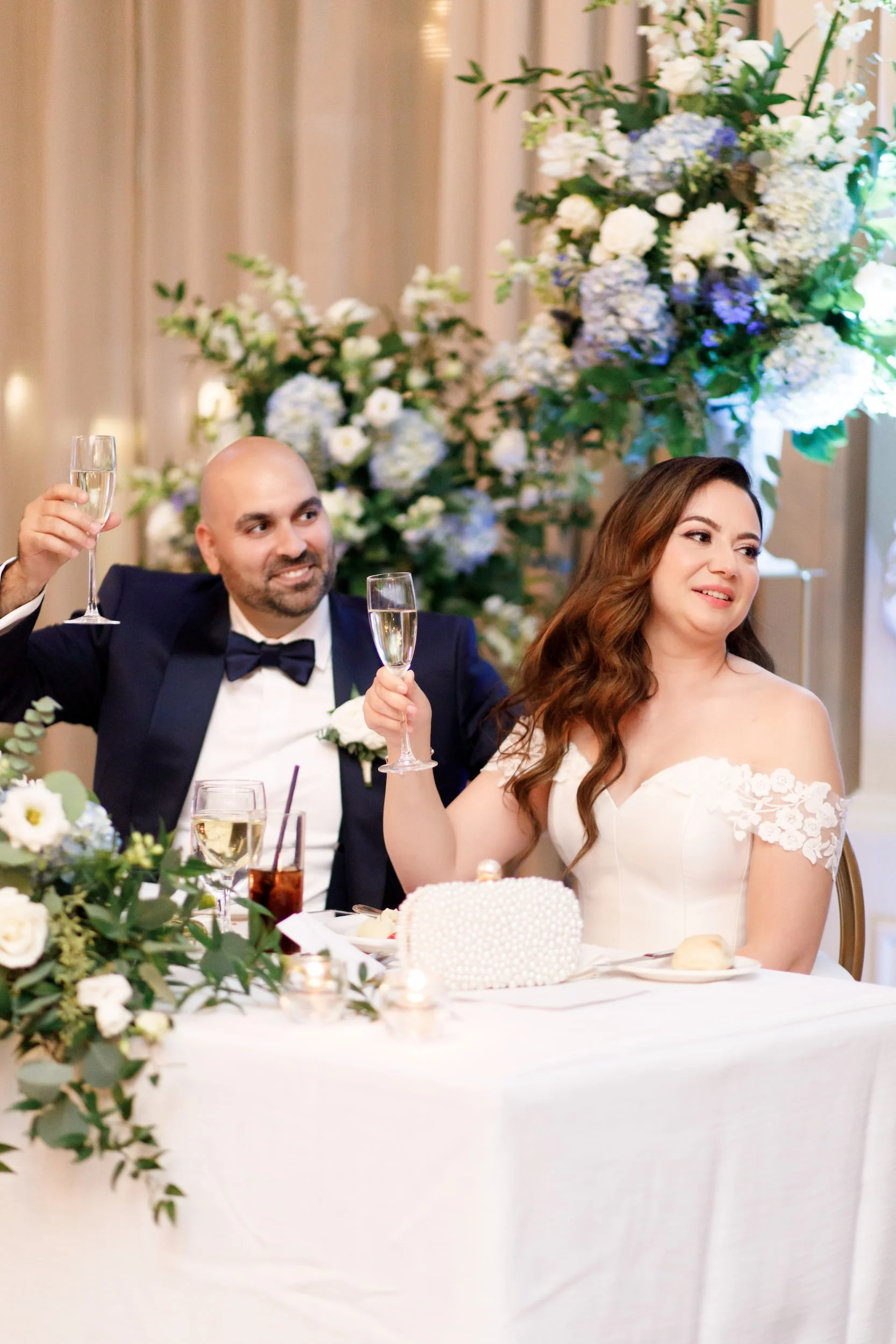 Head table toast inside the Sovereign Ballroom at Omni King Edward Hotel