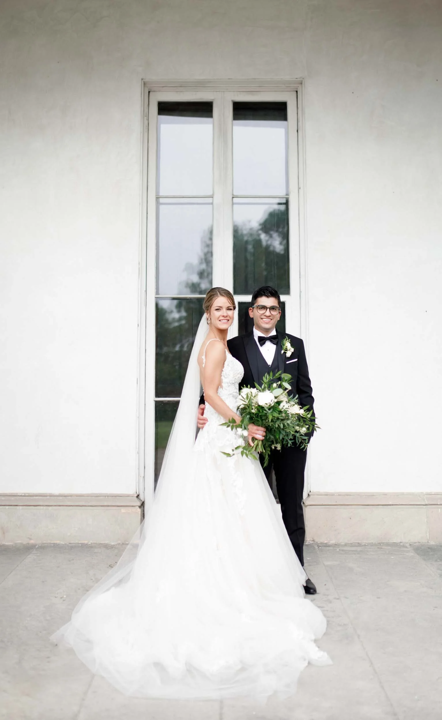 Bride and groom portrait at Dundurn Castle windows