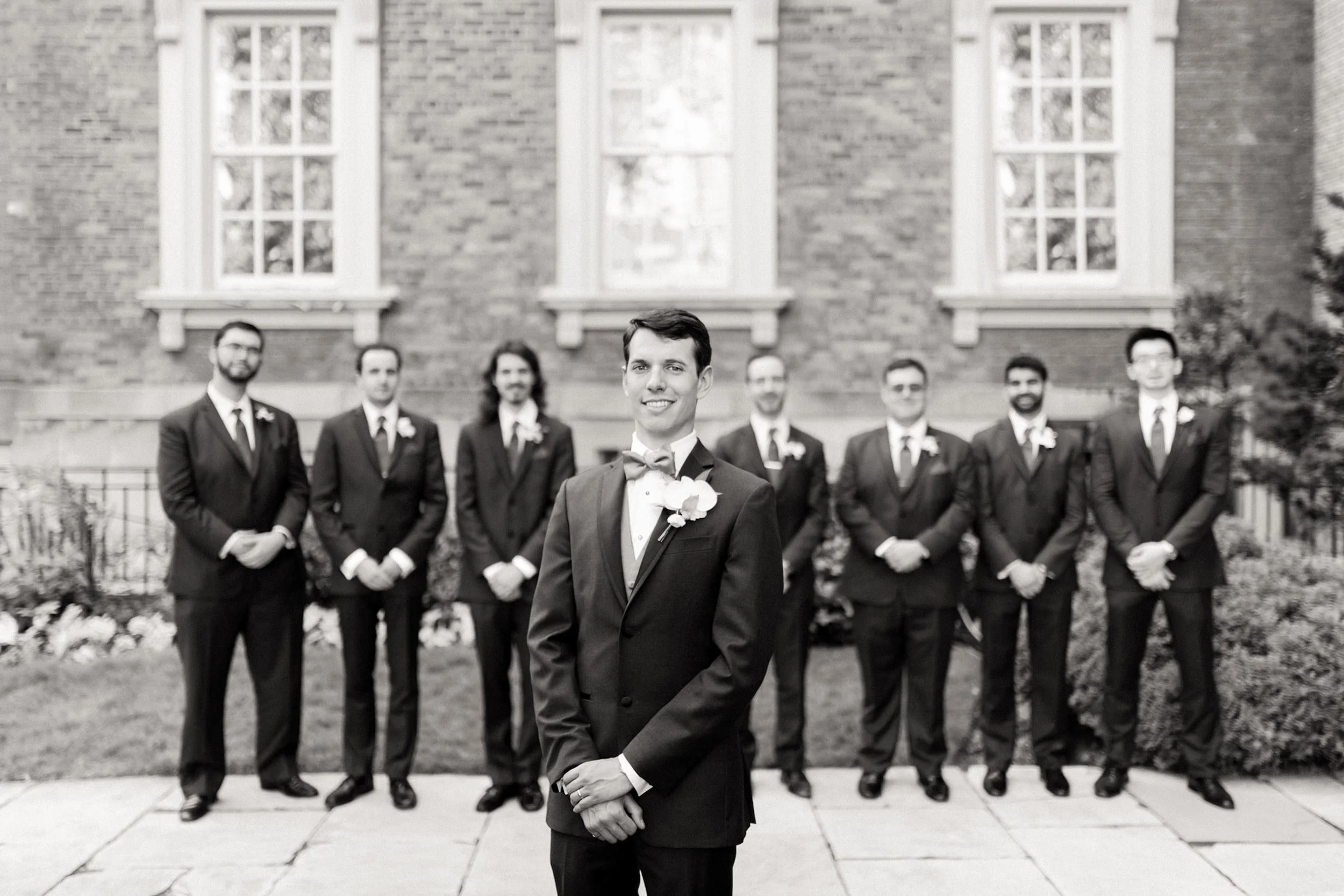 Classic black and white groom portrait at Osgoode Hall courthouse