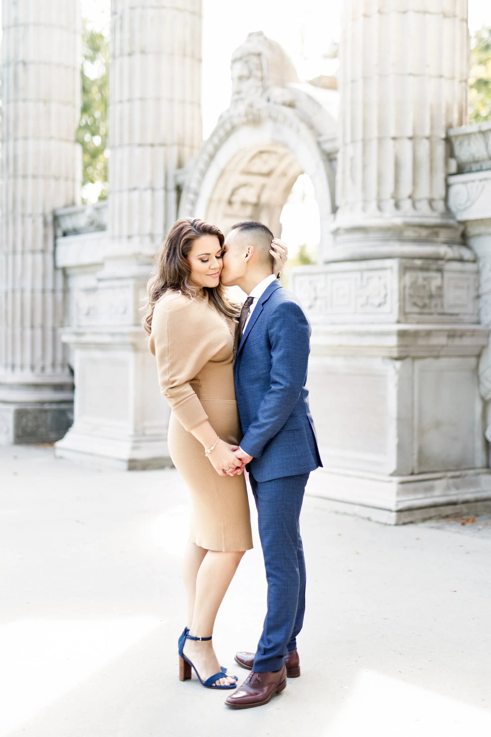 Romantic engagement portrait beneath Guild Inn Estate columns